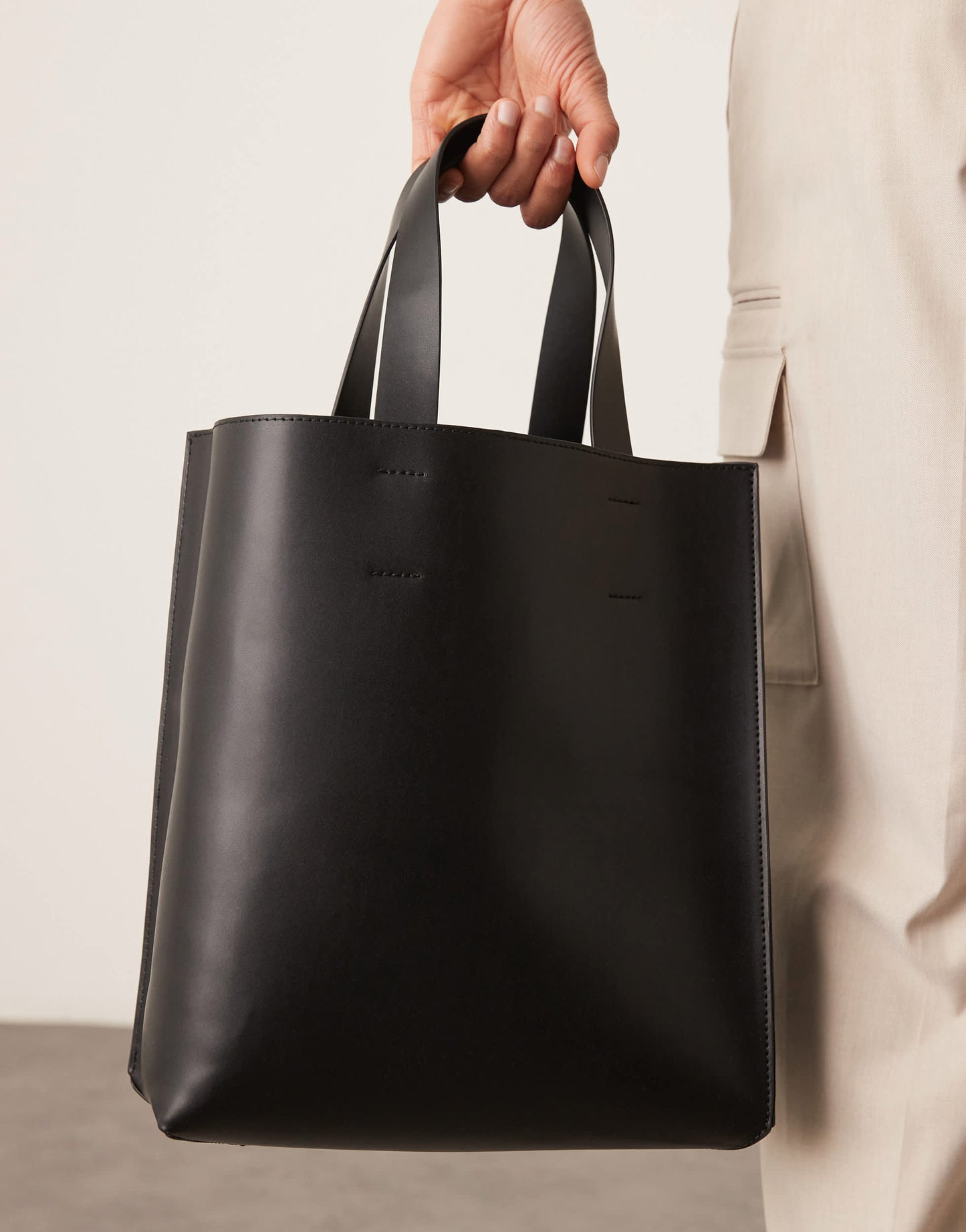 ASOS DESIGN faux leather tote bag with crossbody strap in black