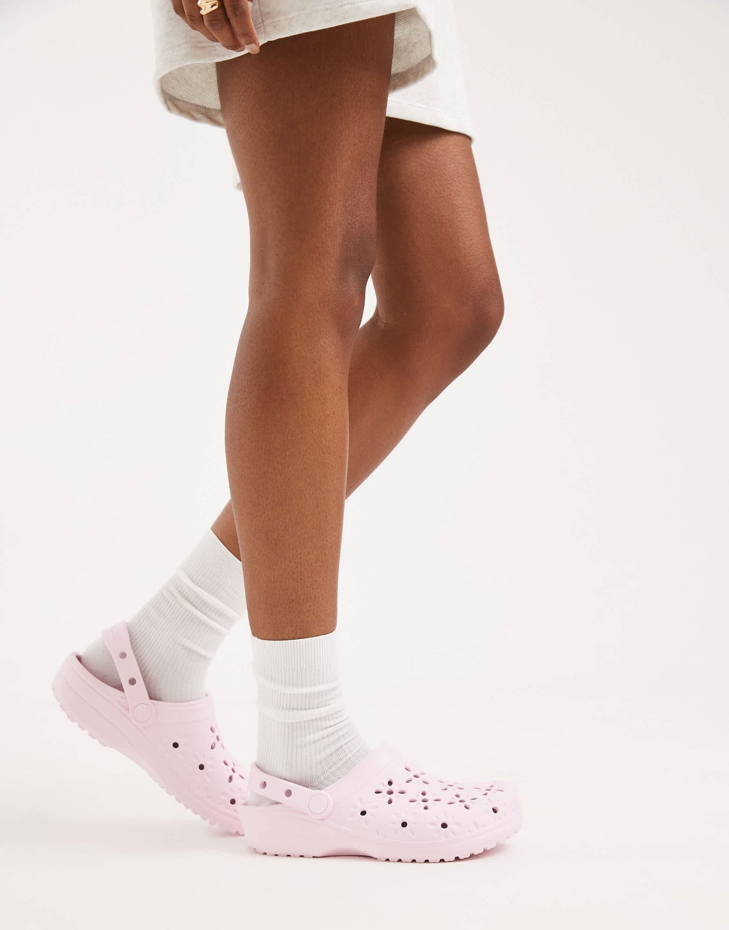 Crocs Classic floral cut out clogs in pink milk