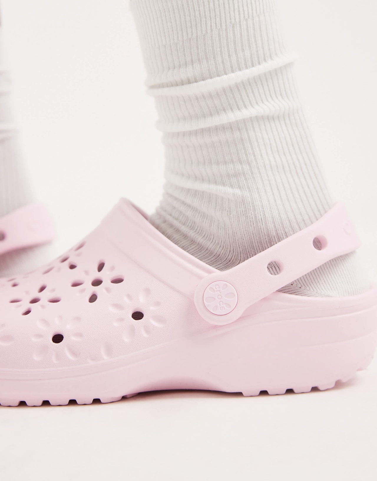 Crocs Classic floral cut out clogs in pink milk
