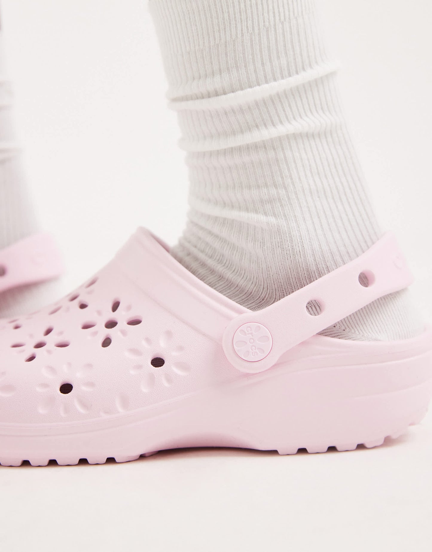 Crocs Classic floral cut out clogs in pink milk