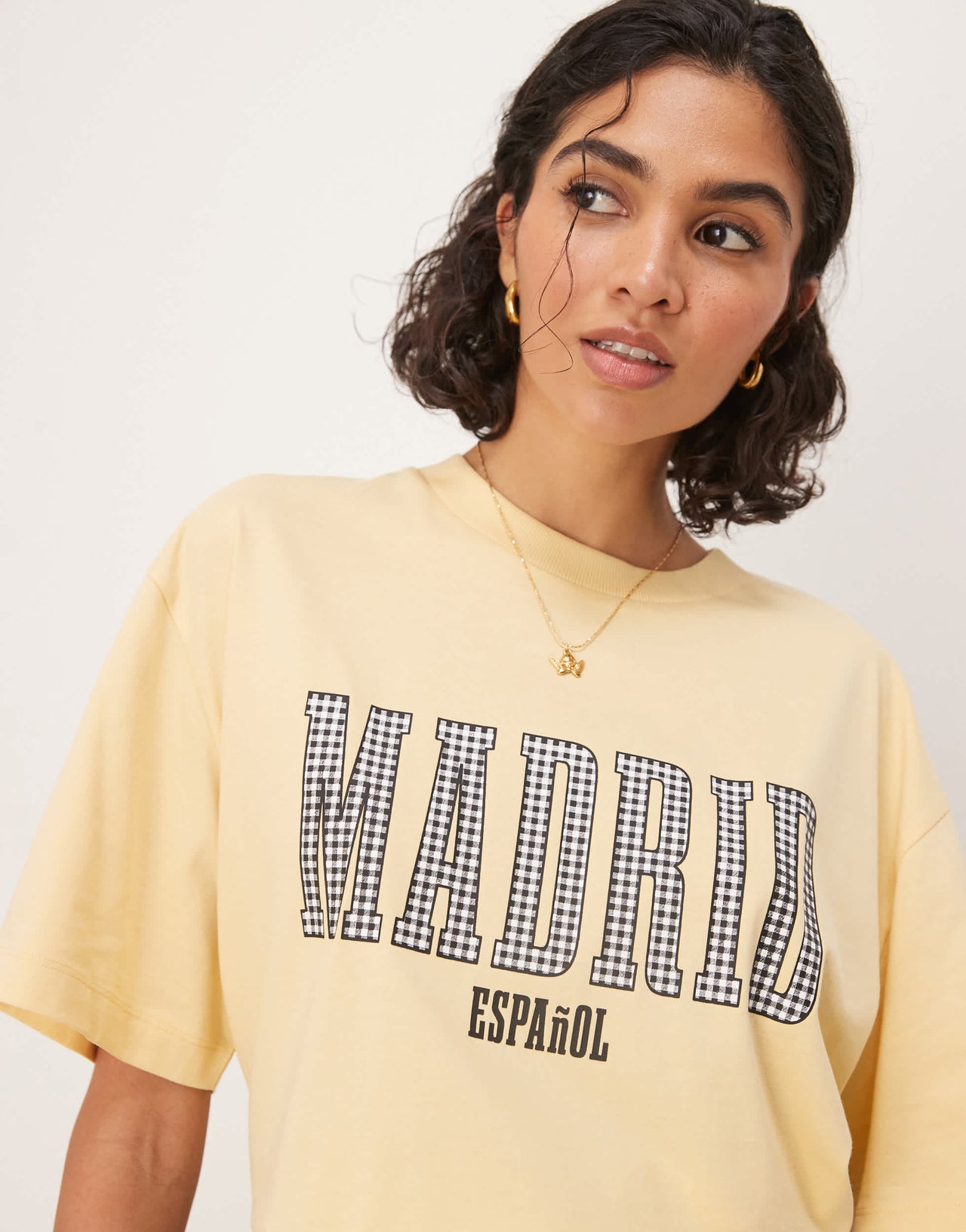 ASOS DESIGN oversized t-shirt with madrid graphic in black gingham in yellow
