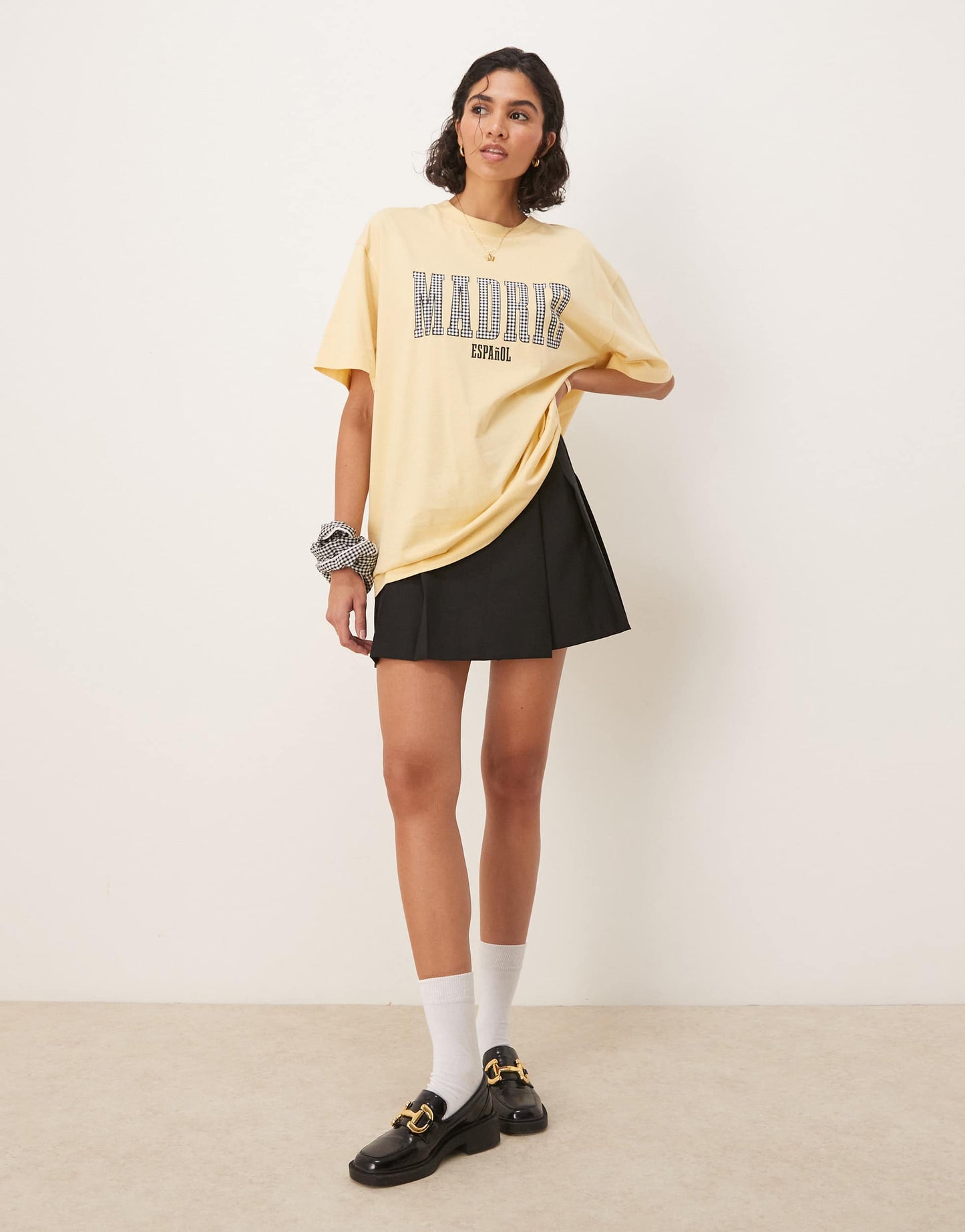 ASOS DESIGN oversized t-shirt with madrid graphic in black gingham in yellow