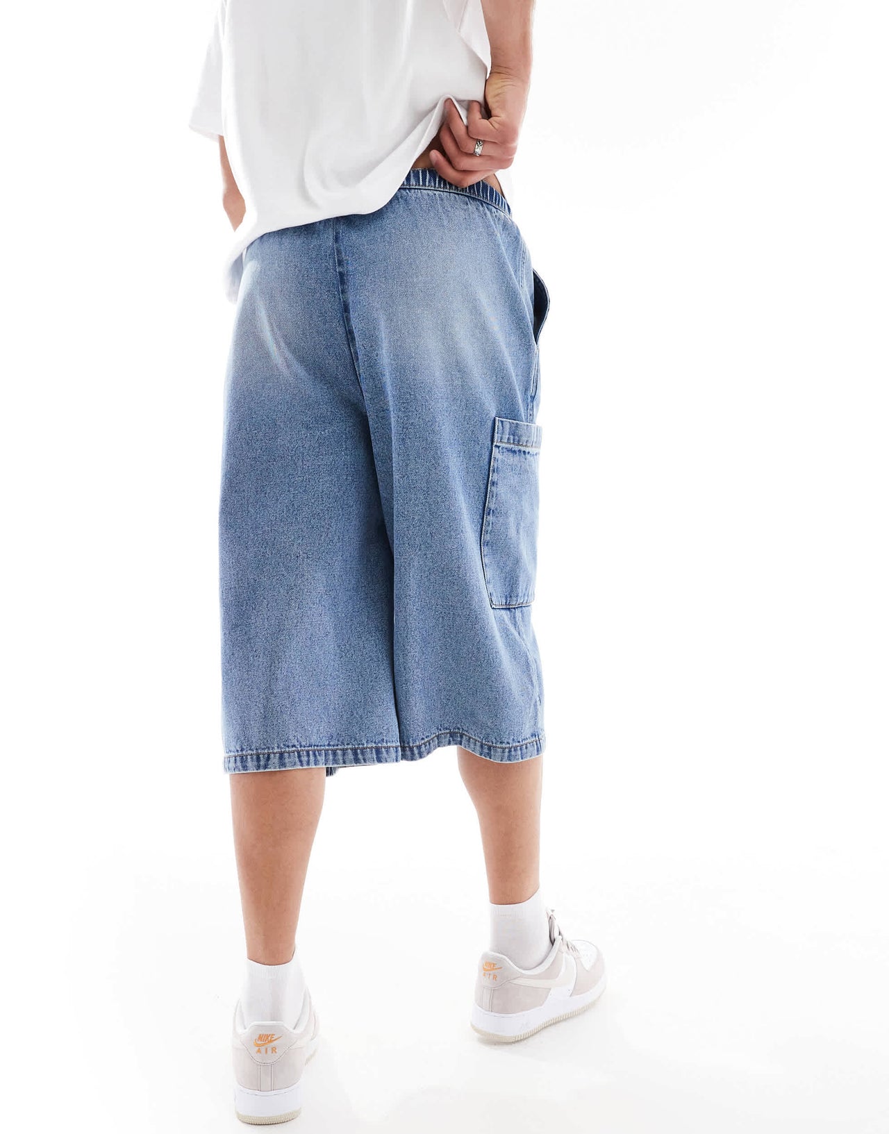 ASOS DESIGN longer length denim jort in mid wash blue with cargo pocket details