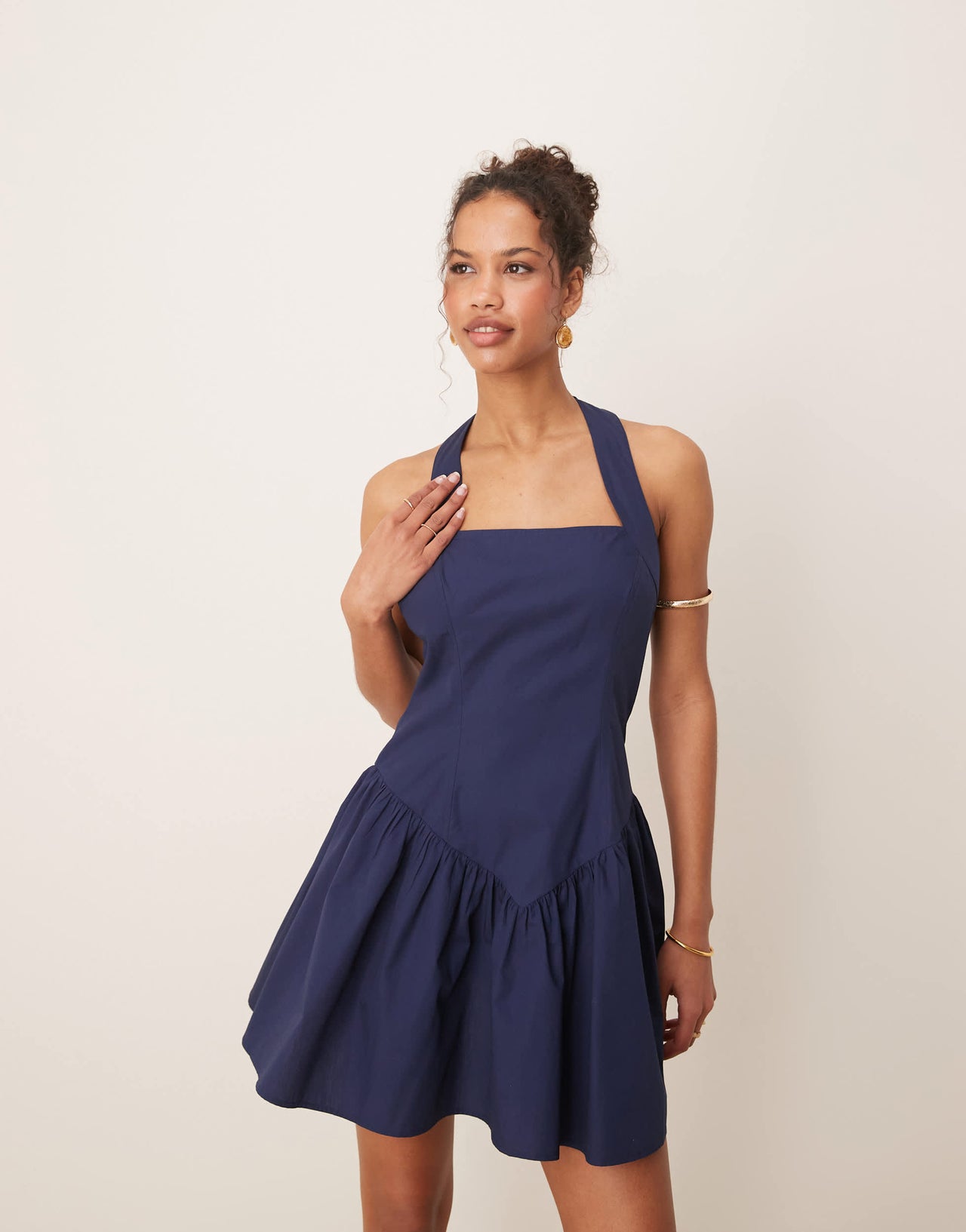 ASOS DESIGN halter mini sundress with ruffle hem in navy