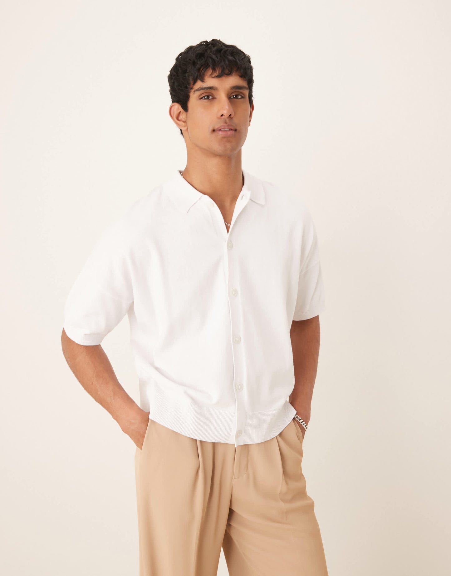 ASOS DESIGN oversized knitted cotton button through polo in white