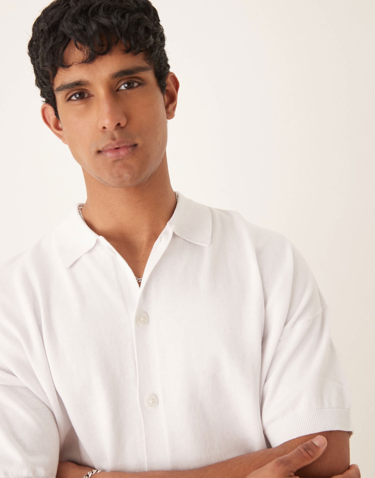 ASOS DESIGN oversized knitted cotton button through polo in white