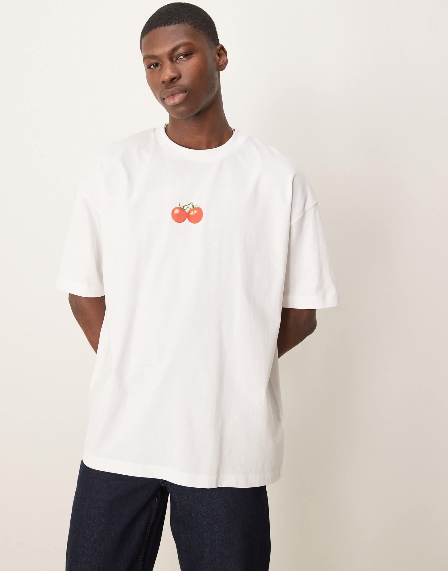 ASOS DESIGN oversized t-shirt with cartoon graphic in white