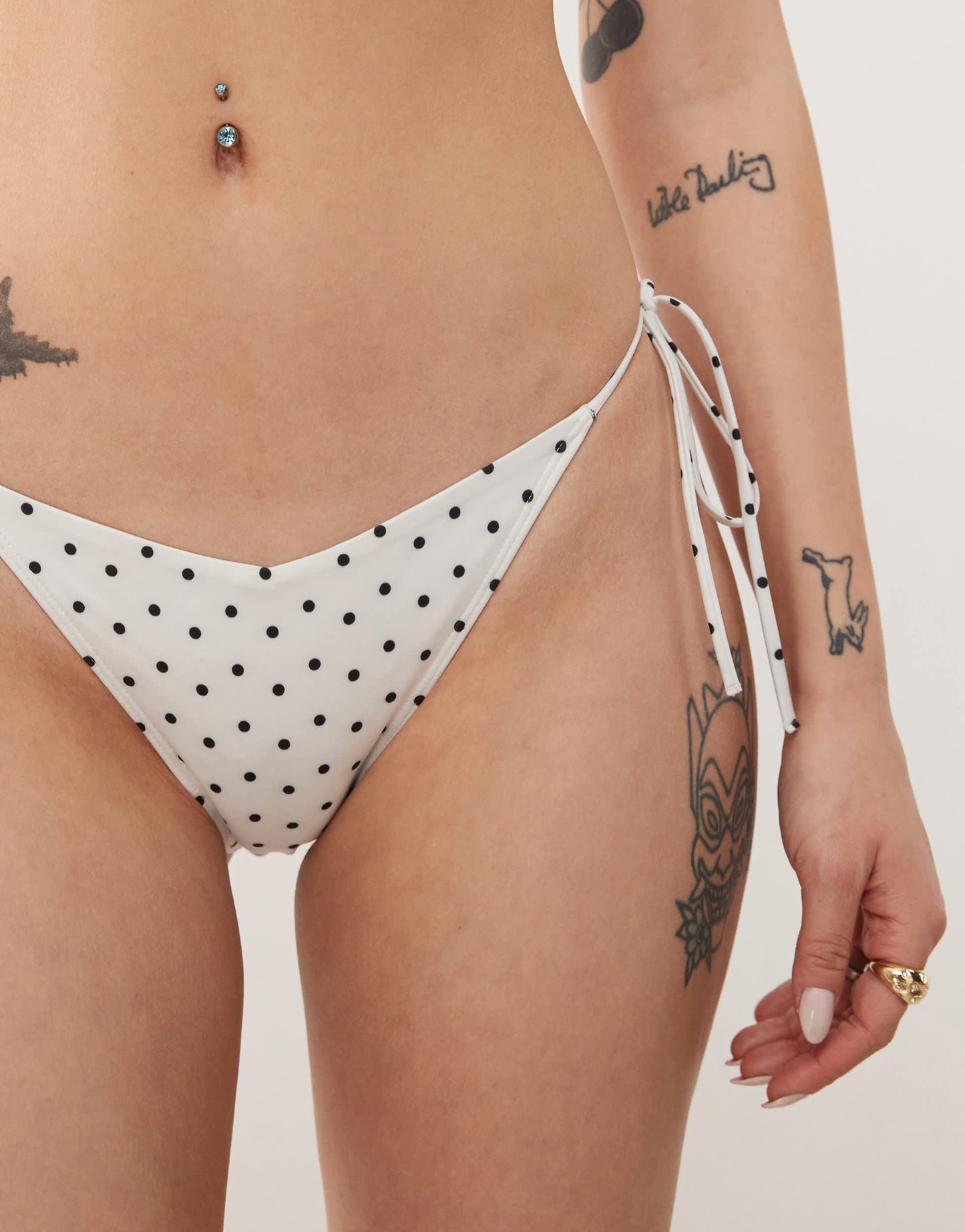 Monki mix and match tie side bikini bottom in white and black polka dot