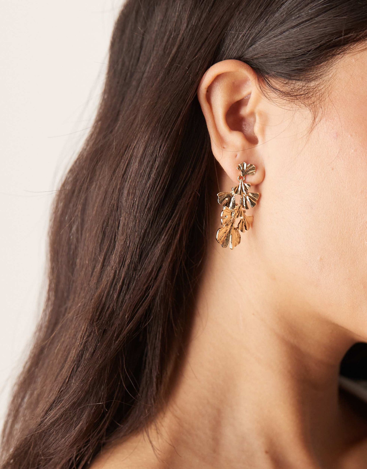 ASOS DESIGN drop earrings with multi petal detail in gold tone