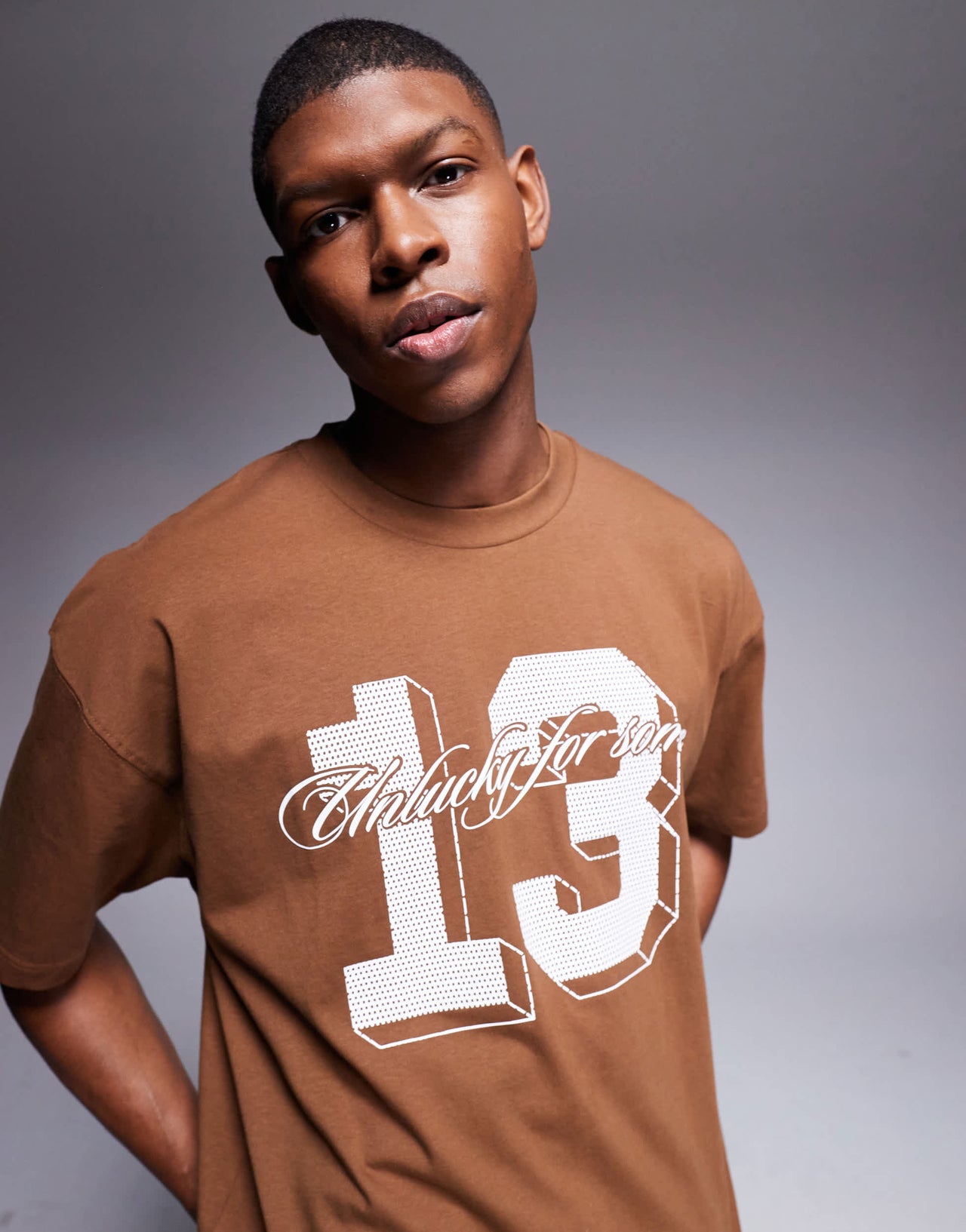 ASOS DESIGN oversized t-shirt with sports graphic in brown