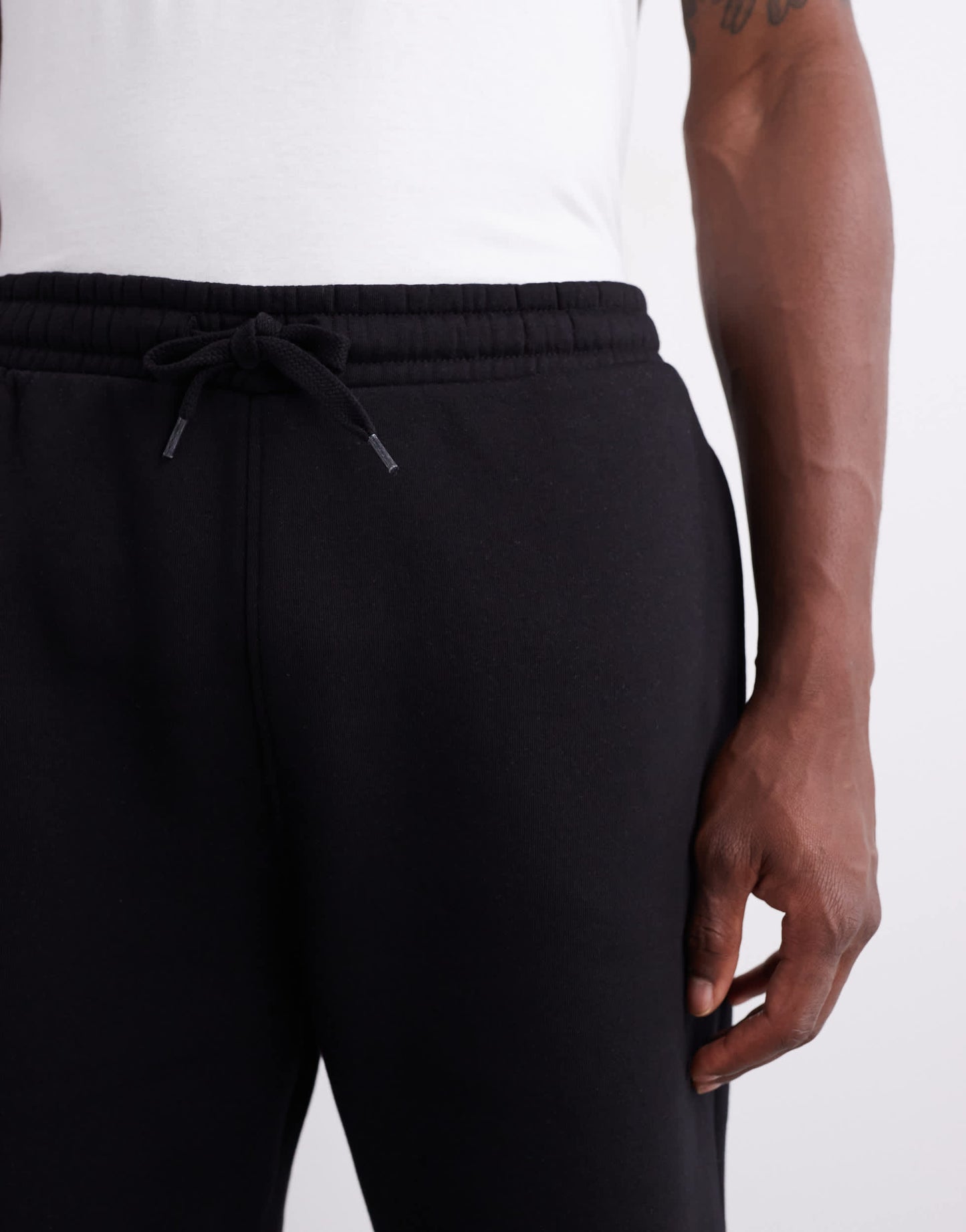 ASOS DESIGN essentials mid length slim shorts in black