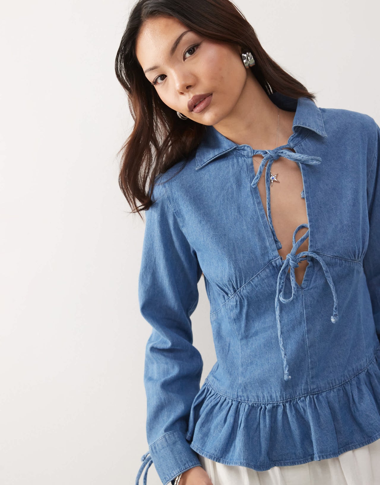 Reclaimed Vintage long sleeve denim tie front top with peplum hem in mid blue