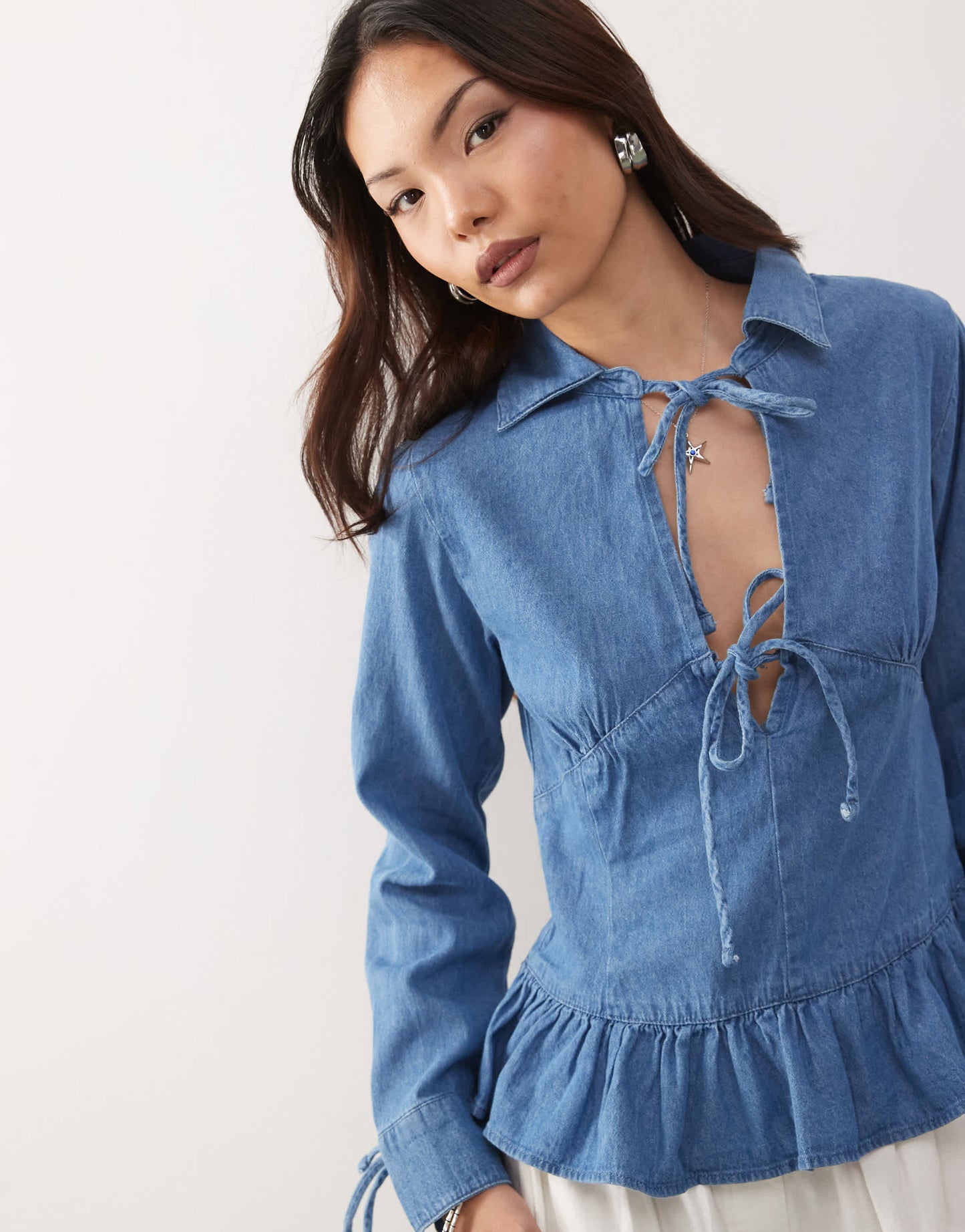 Reclaimed Vintage long sleeve denim tie front top with peplum hem in mid blue