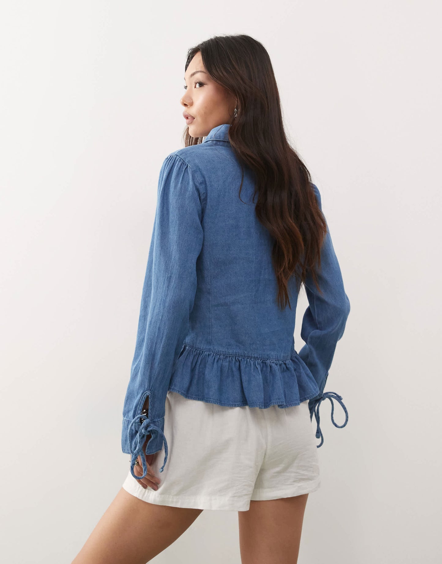 Reclaimed Vintage long sleeve denim tie front top with peplum hem in mid blue