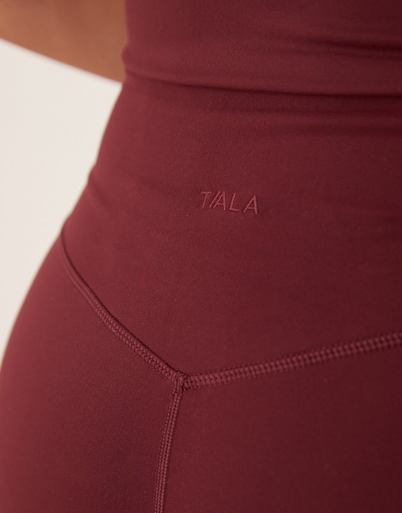 TALA DayFlex wrap high waisted flared yoga pant in burgundy