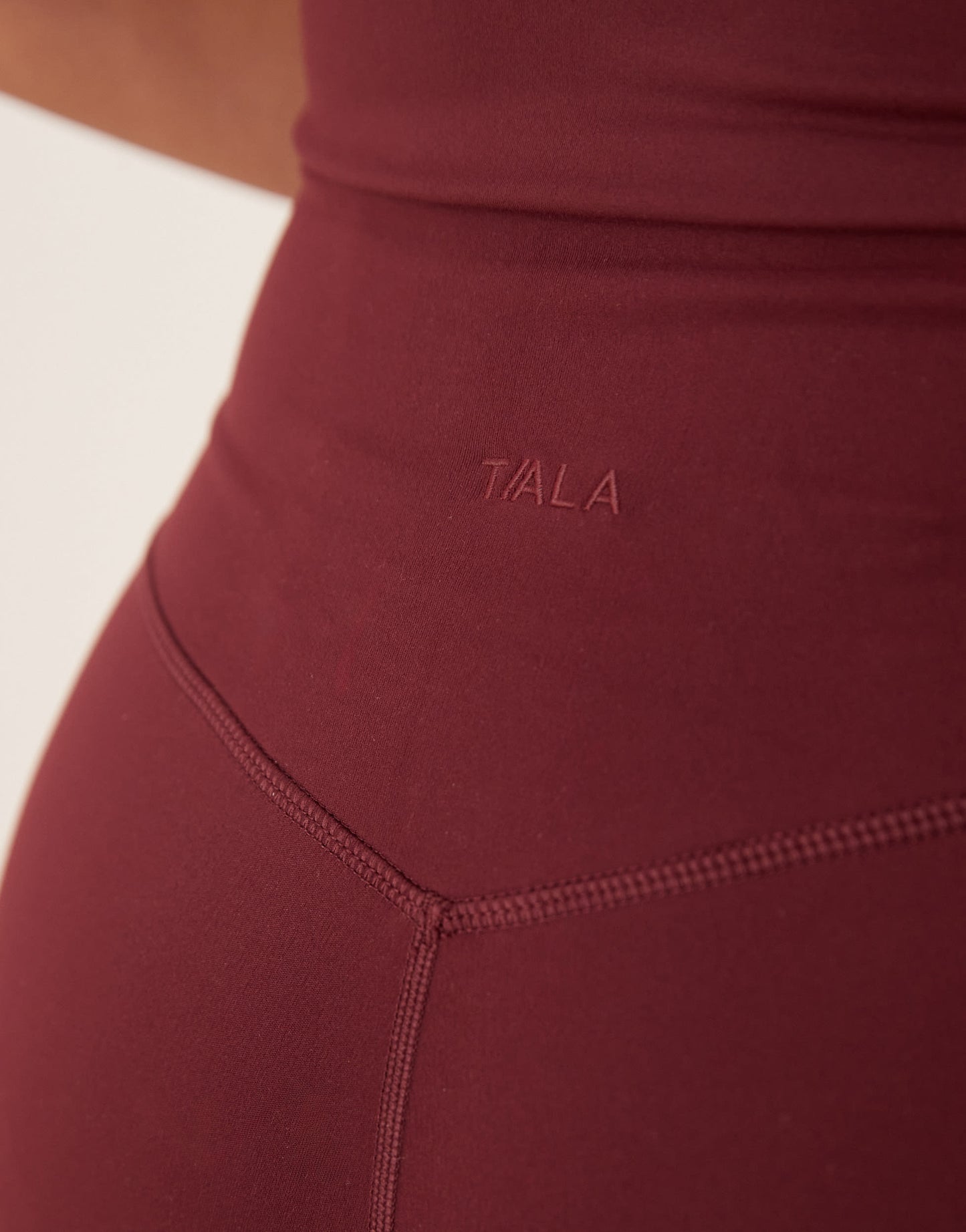 TALA DayFlex wrap high waisted flared yoga pant in burgundy