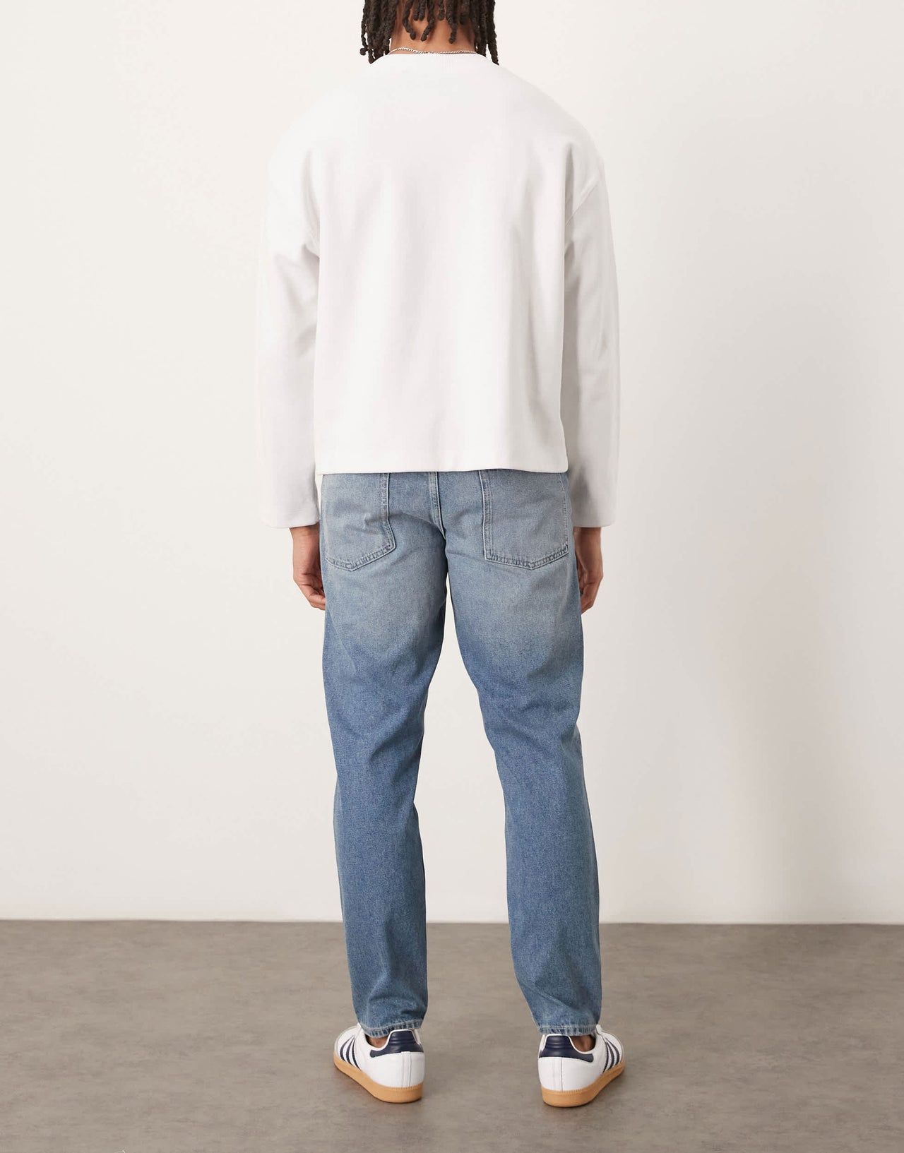 ASOS DESIGN tapered jeans in light wash blue