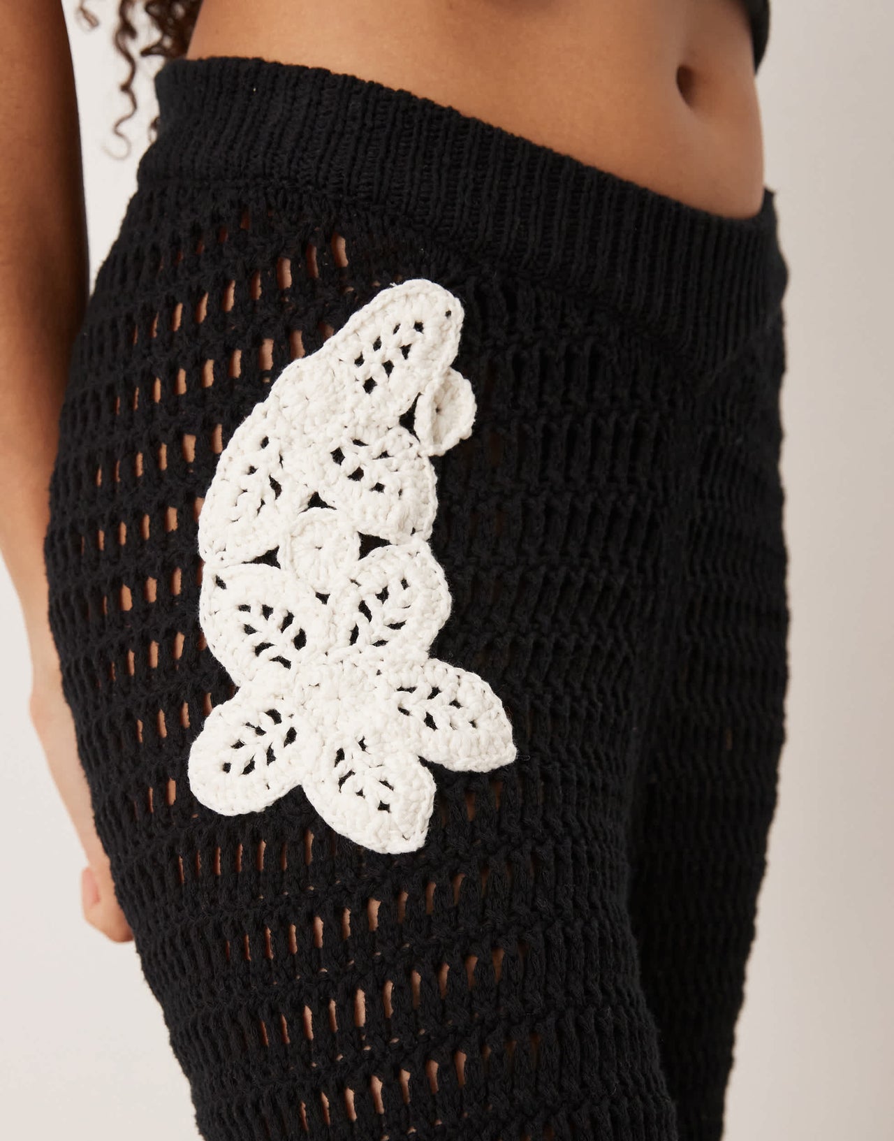 ASOS DESIGN knitted crochet wide leg trouser co-ord with flower patch detail in mono