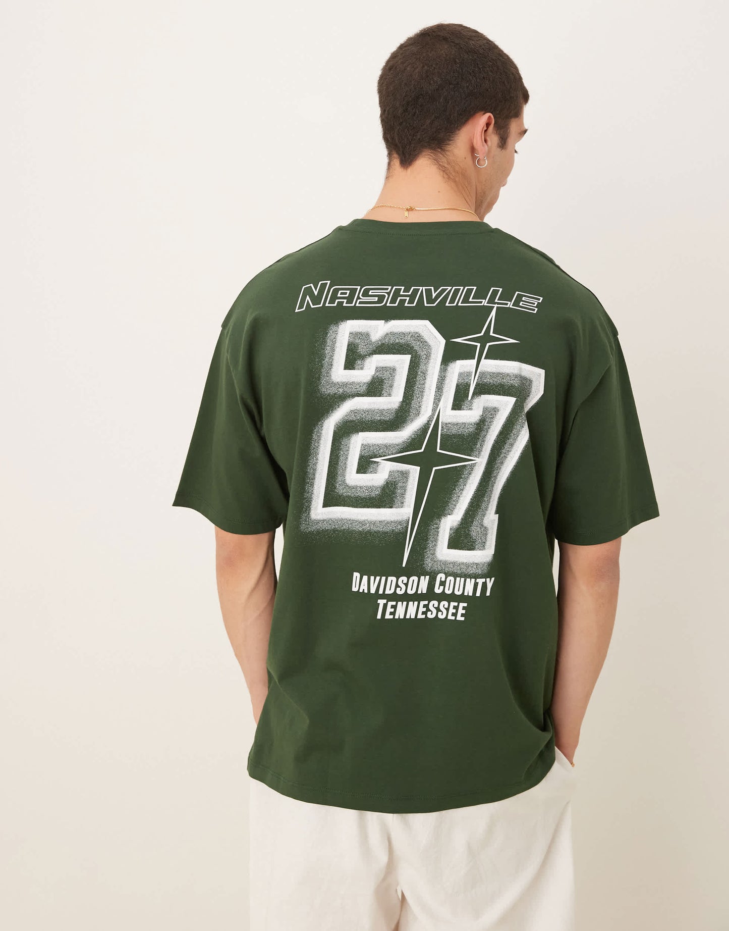 ASOS DESIGN oversized t-shirt with city graphic in dark green