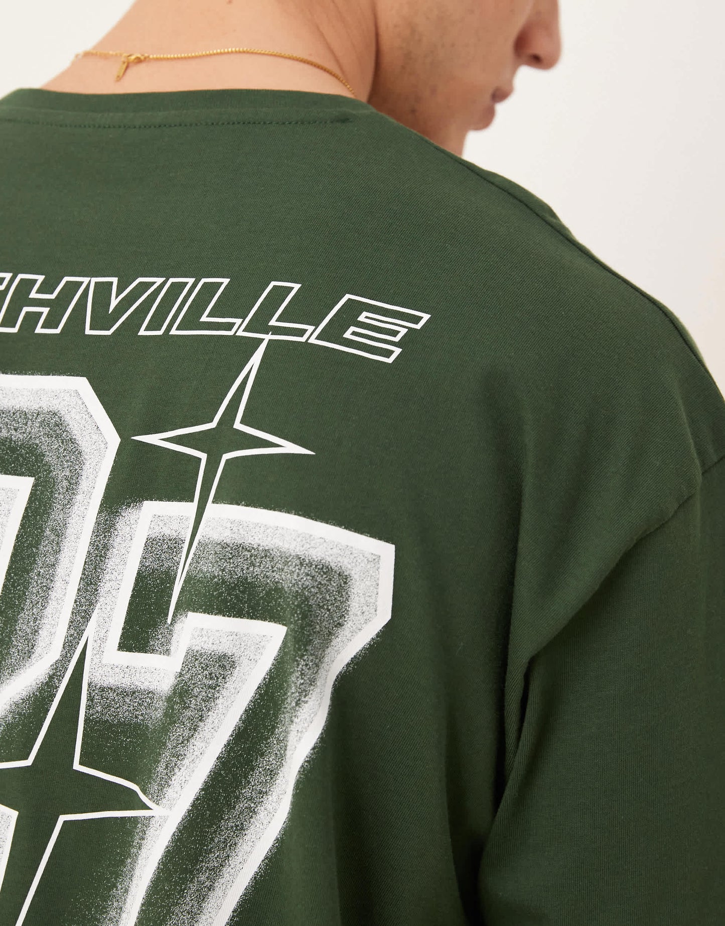 ASOS DESIGN oversized t-shirt with city graphic in dark green