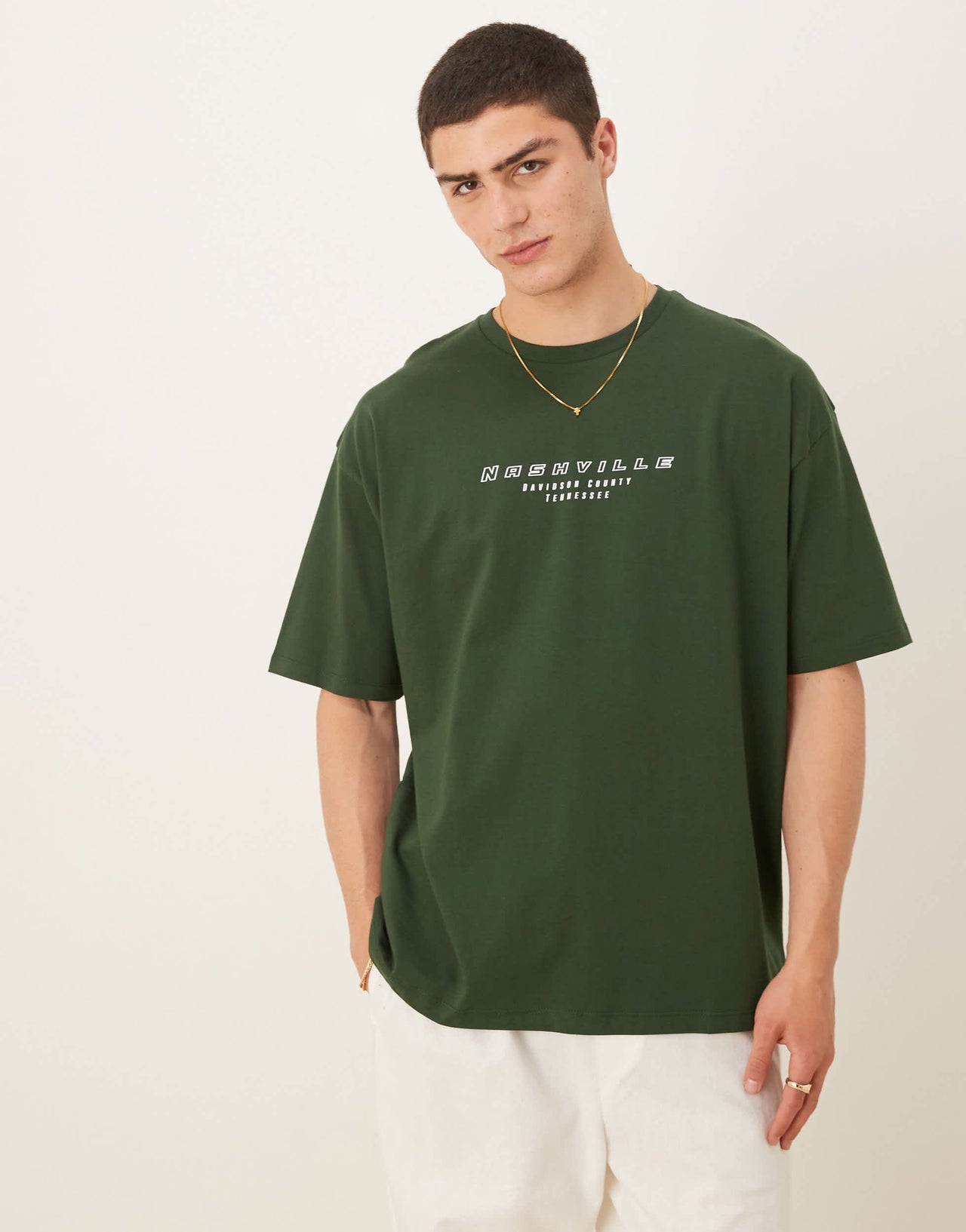 ASOS DESIGN oversized t-shirt with city graphic in dark green