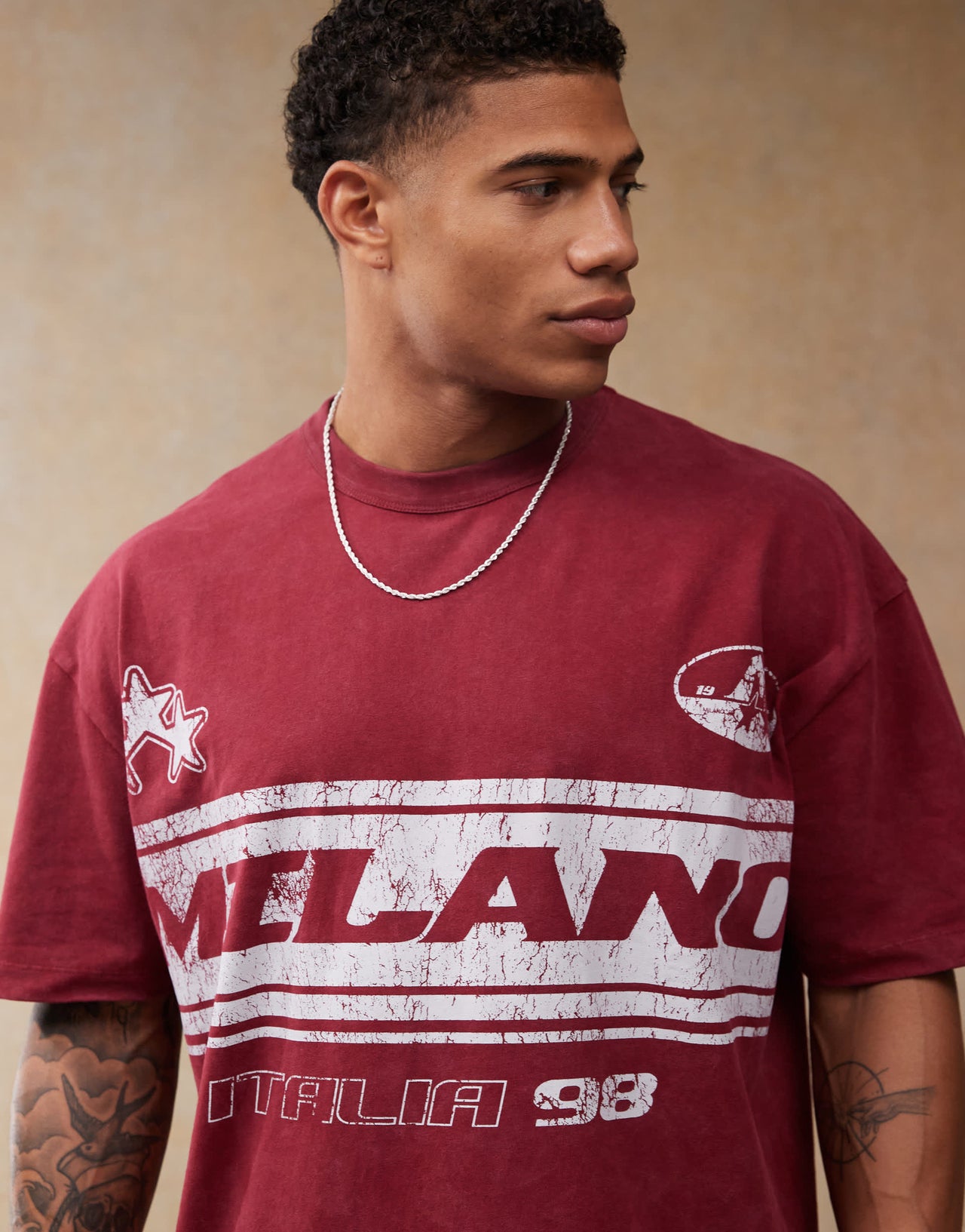 ASOS DESIGN oversized t-shirt with football chest print in burgundy