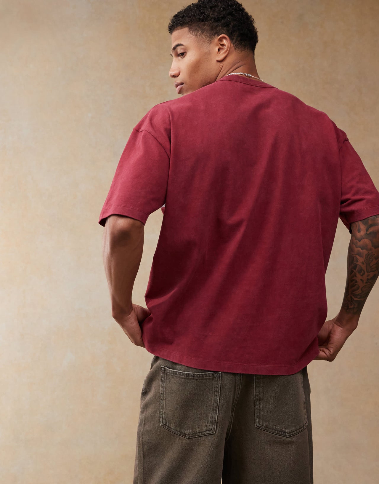 ASOS DESIGN oversized t-shirt with football chest print in burgundy