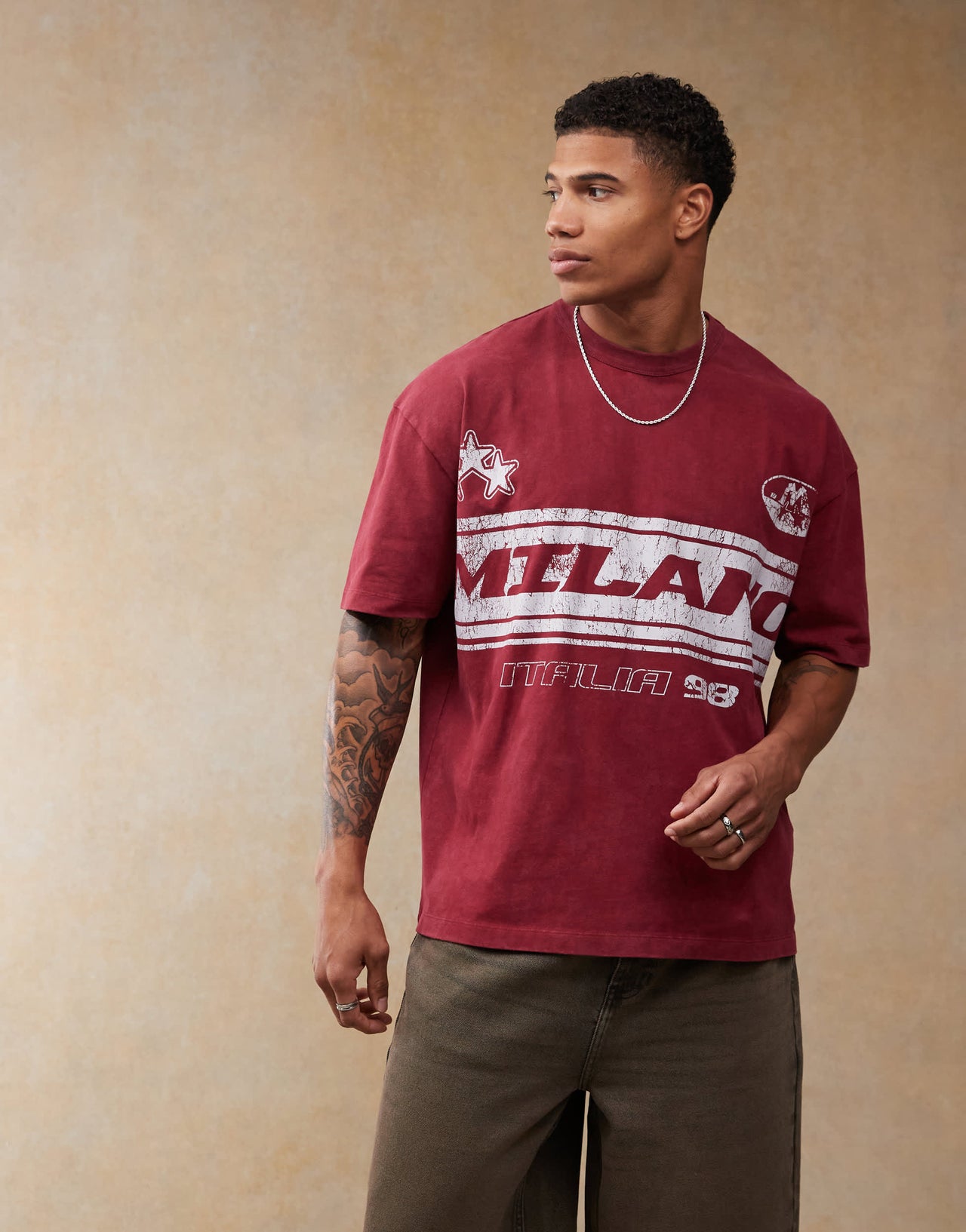 ASOS DESIGN oversized t-shirt with football chest print in burgundy