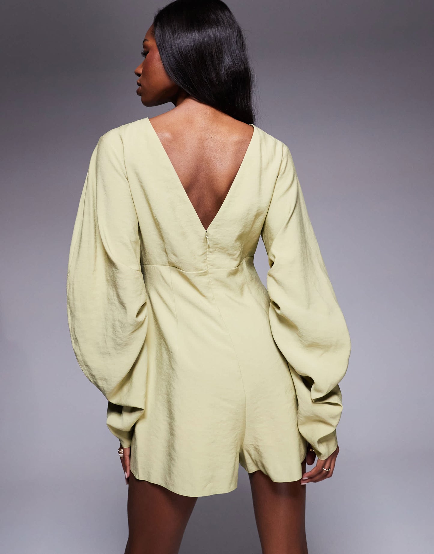 ASOS DESIGN curved sleeve playsuit with pleating detail in soft green
