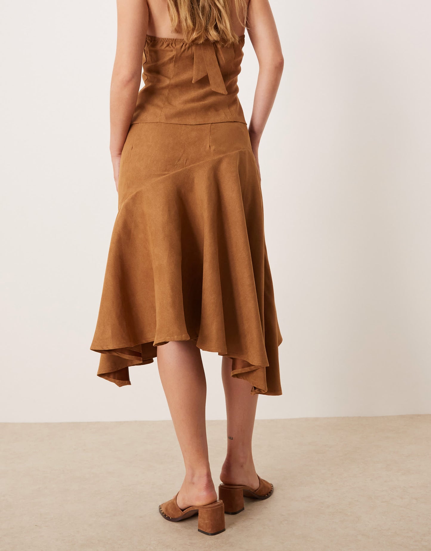 Kiss The Sky low waist asymmetric faux suede midi skirt in brown