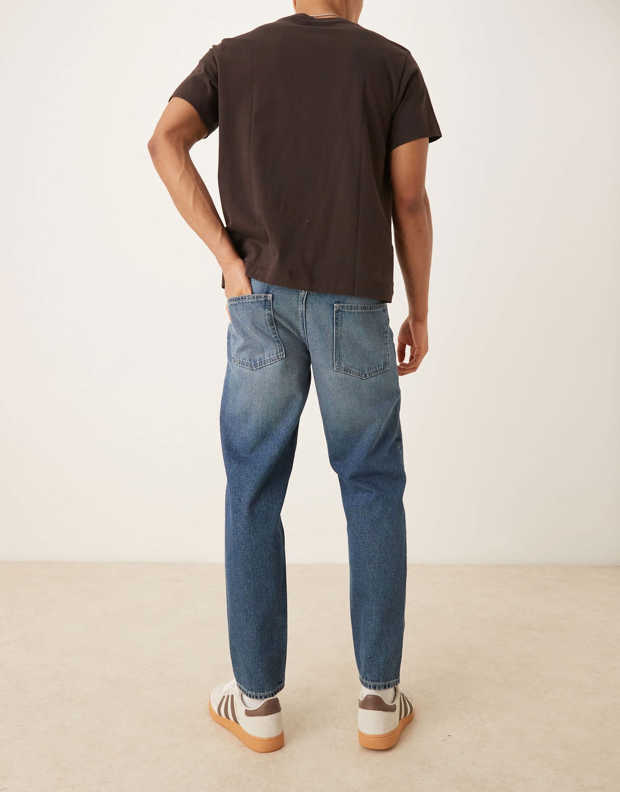 ASOS DESIGN tapered fit jeans with vintage tint in light wash blue