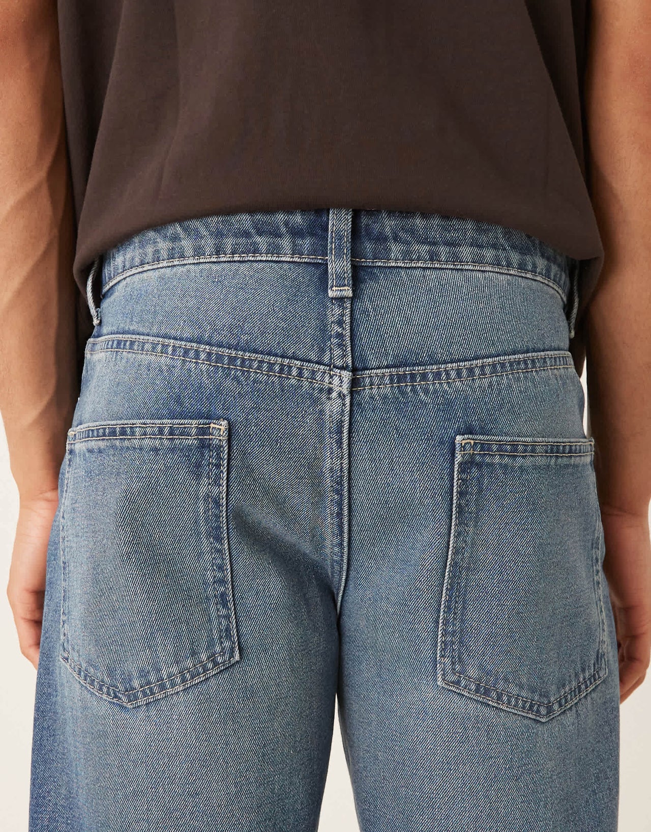 ASOS DESIGN tapered fit jeans with vintage tint in light wash blue