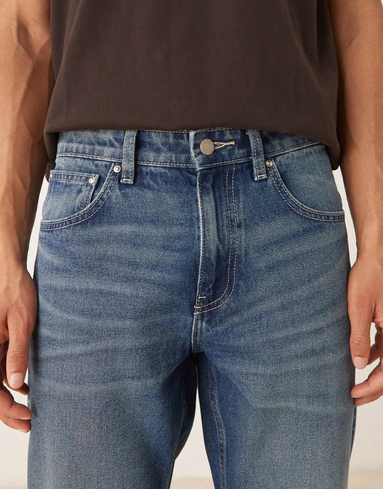 ASOS DESIGN tapered fit jeans with vintage tint in light wash blue