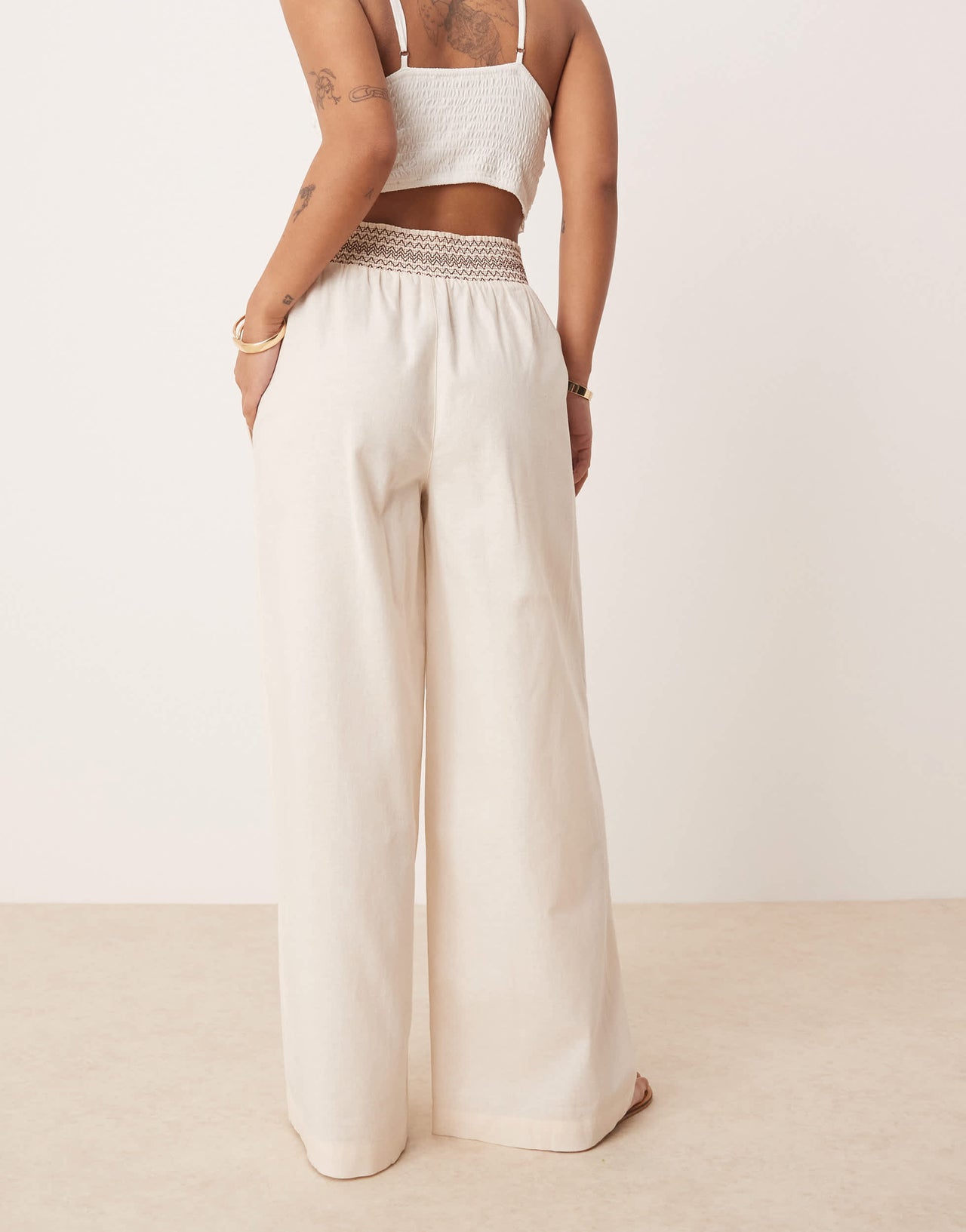 ASOS DESIGN Petite linen blend pull on wide leg trousers with shirred waist detail in cream with brown