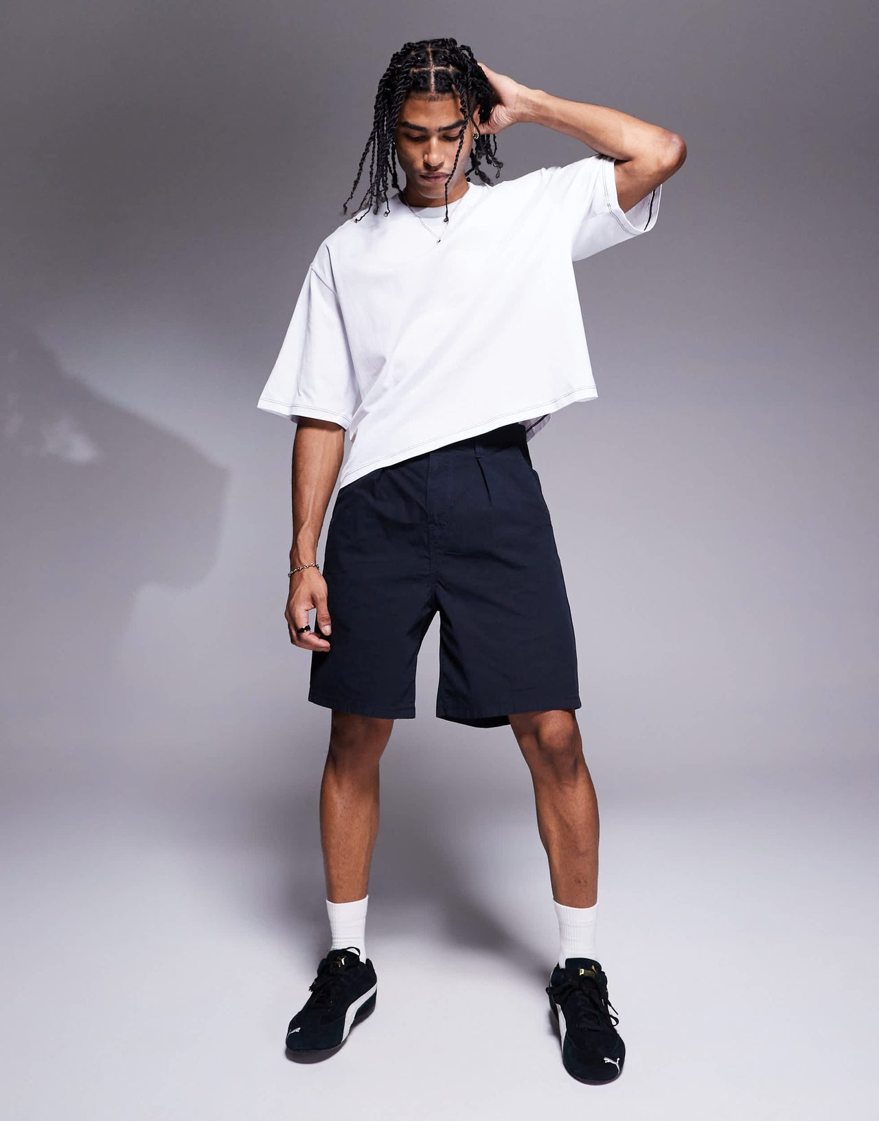 ASOS DESIGN mid length pleated shorts in navy