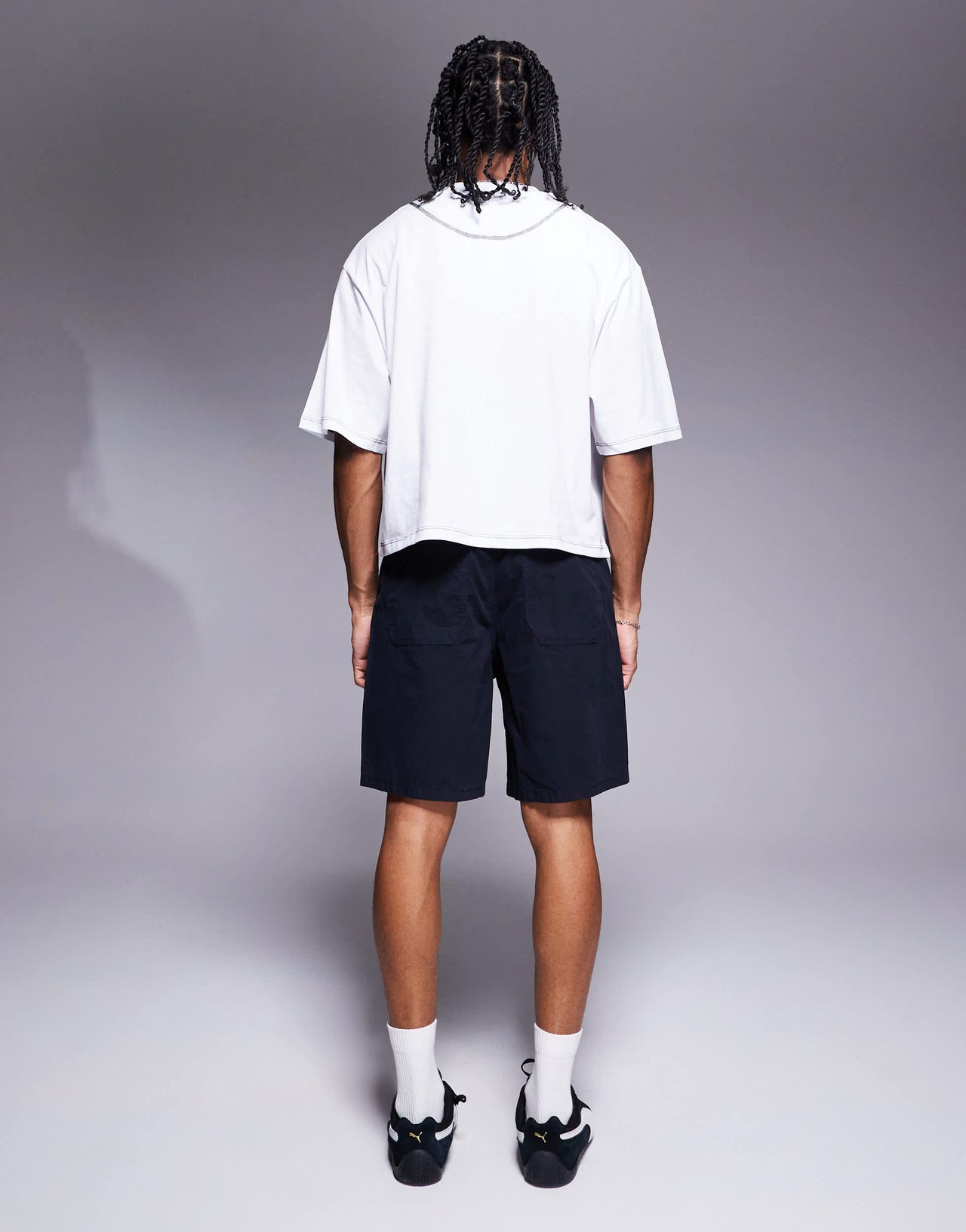 ASOS DESIGN mid length pleated shorts in navy