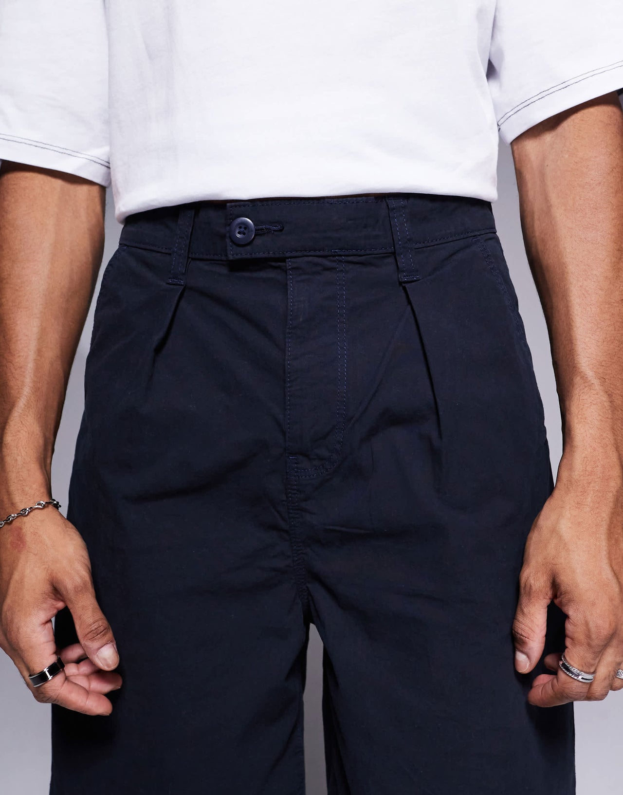 ASOS DESIGN mid length pleated shorts in navy