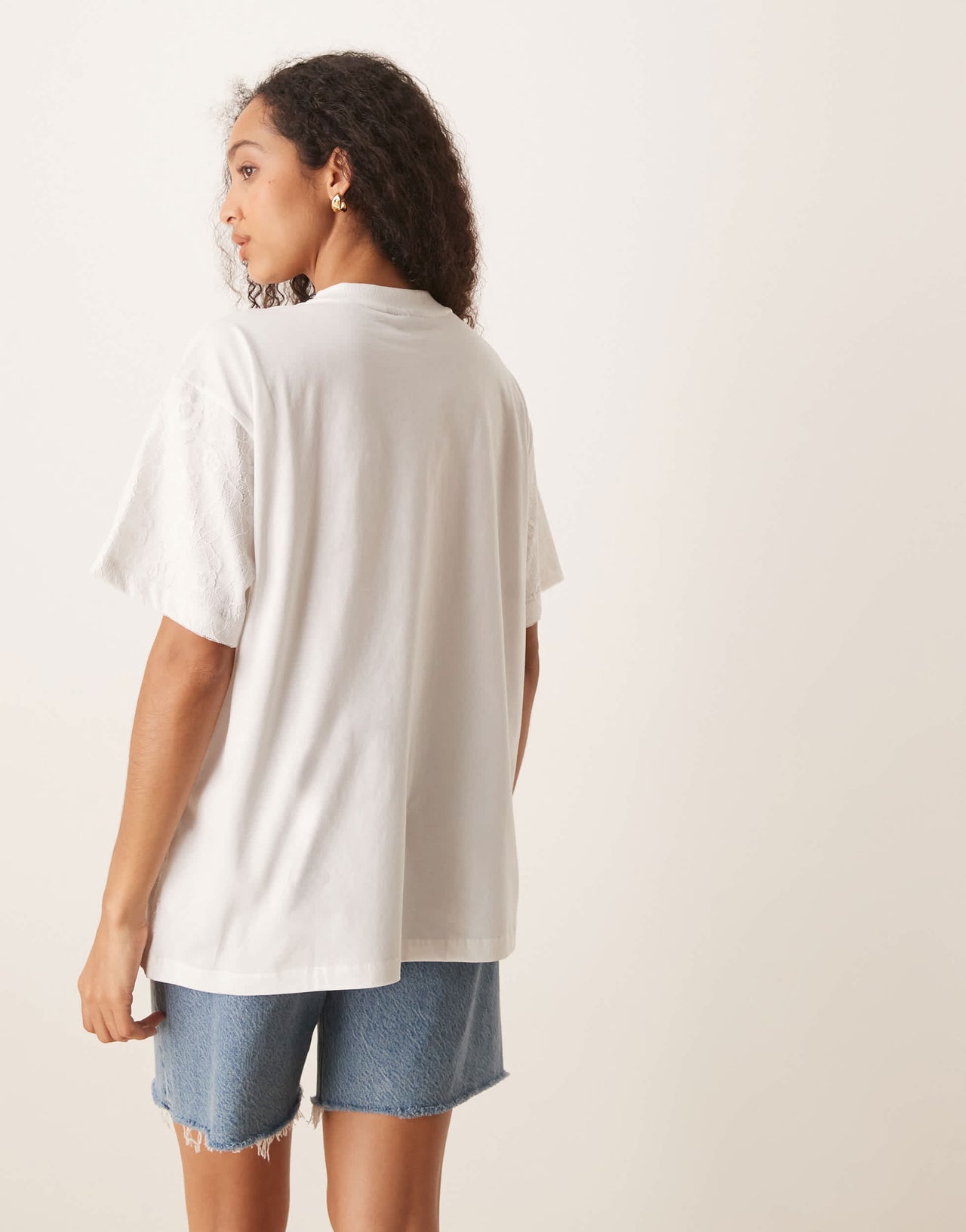 ASOS DESIGN oversized t-shirt with band graphic with lace overlay in white