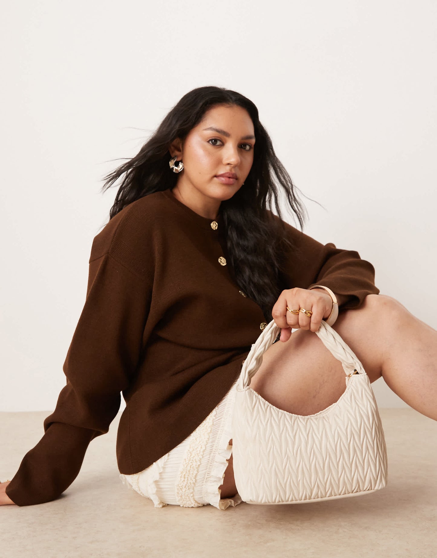 Accessorize quilted handheld bag in cream