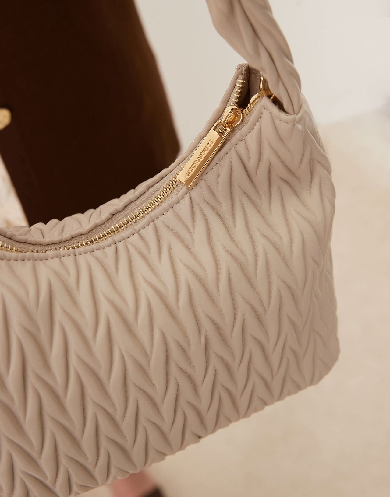 Accessorize quilted handheld bag in cream