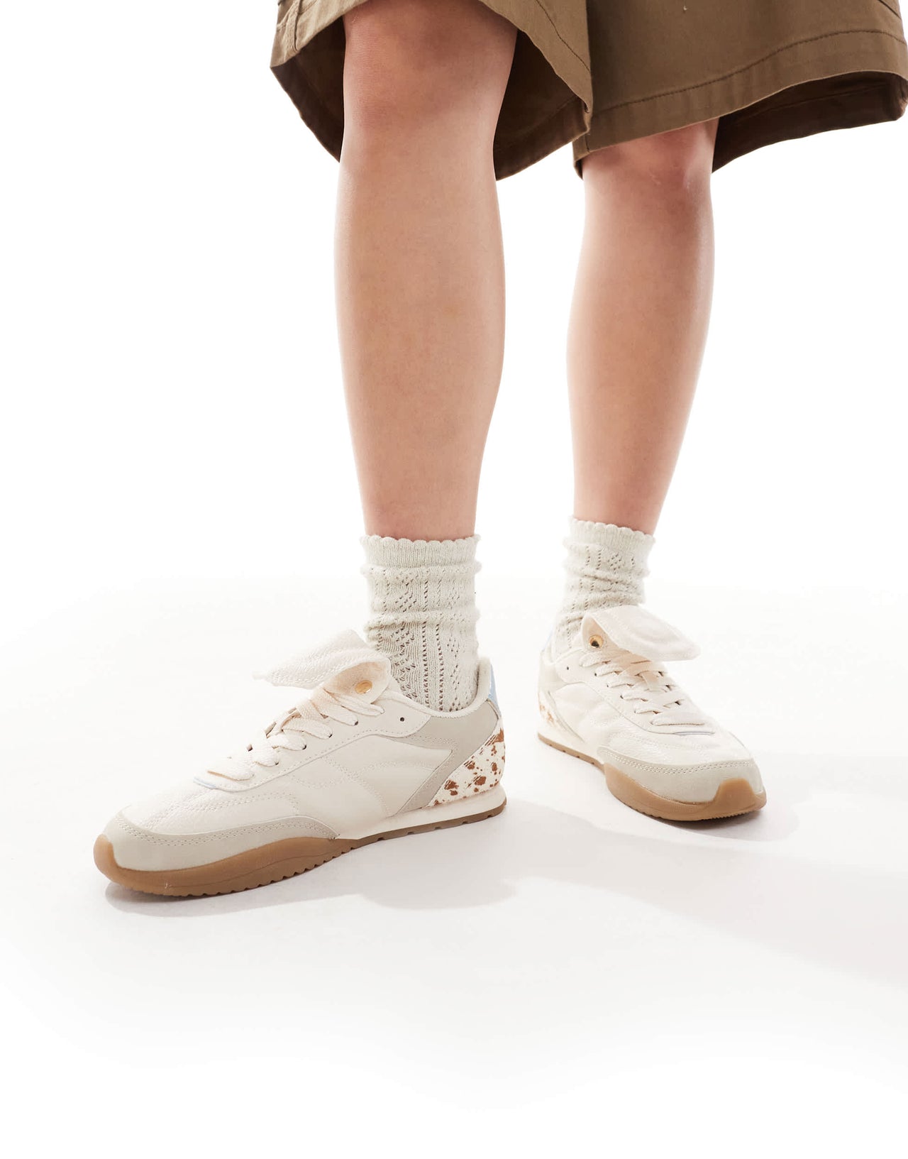 Stradivarius leather trainer in cow print