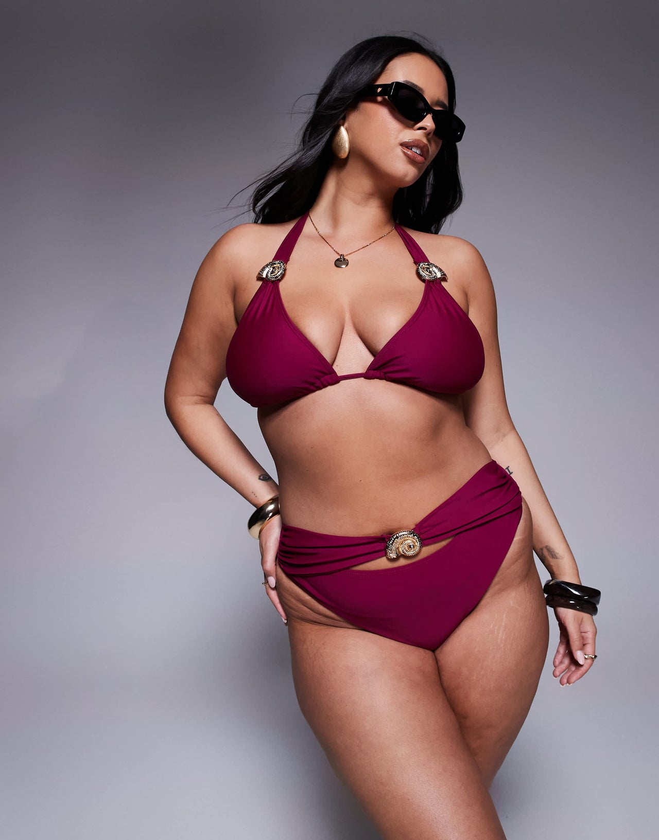 Moda Minx Curve bikini bottom with gold hardware detail in berry