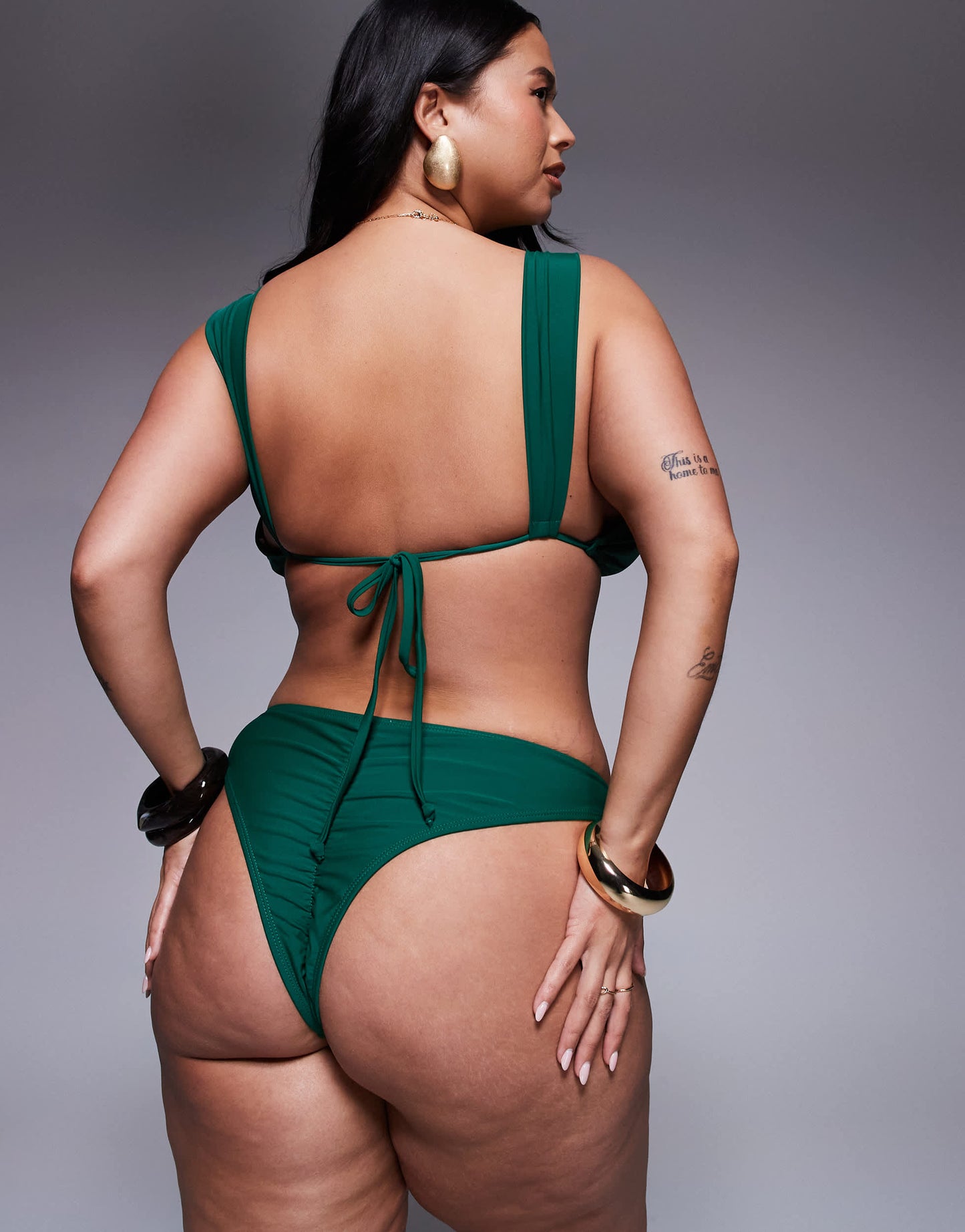 Moda Minx Curve tie side bikini bottom with gold hardware detail in green