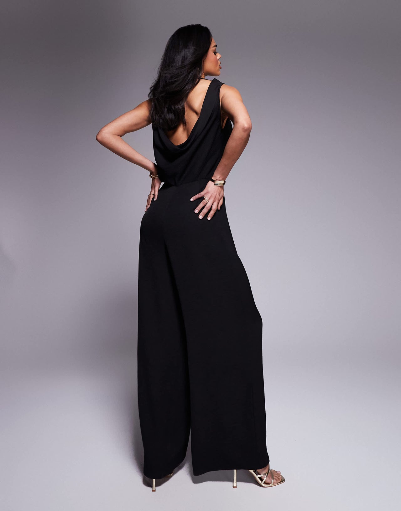 ASOS DESIGN cowl neck wide leg jumpsuit with gold hardware in black