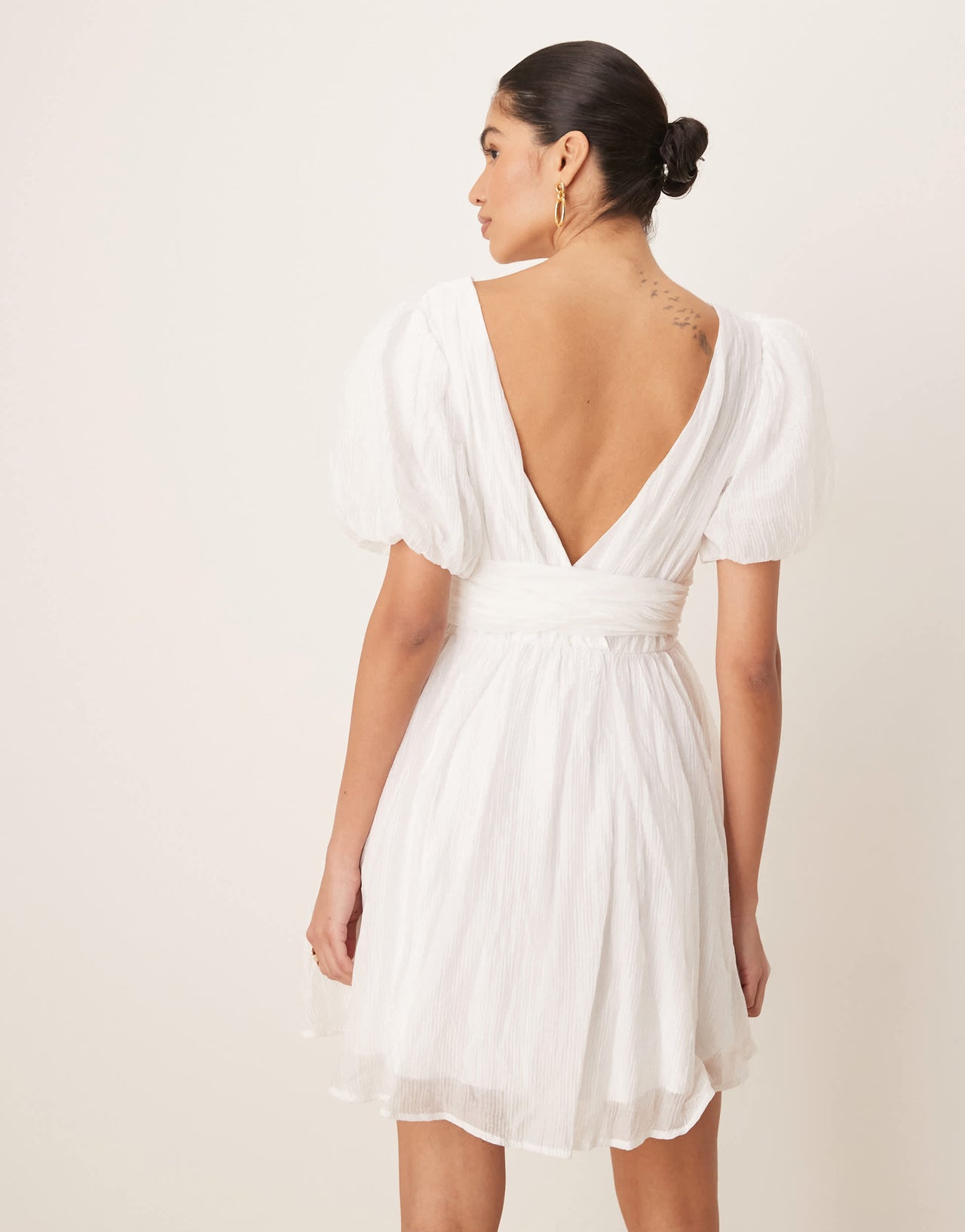 Gina Tricot short sleeve v neck open back bow graduation mini dress in off white
