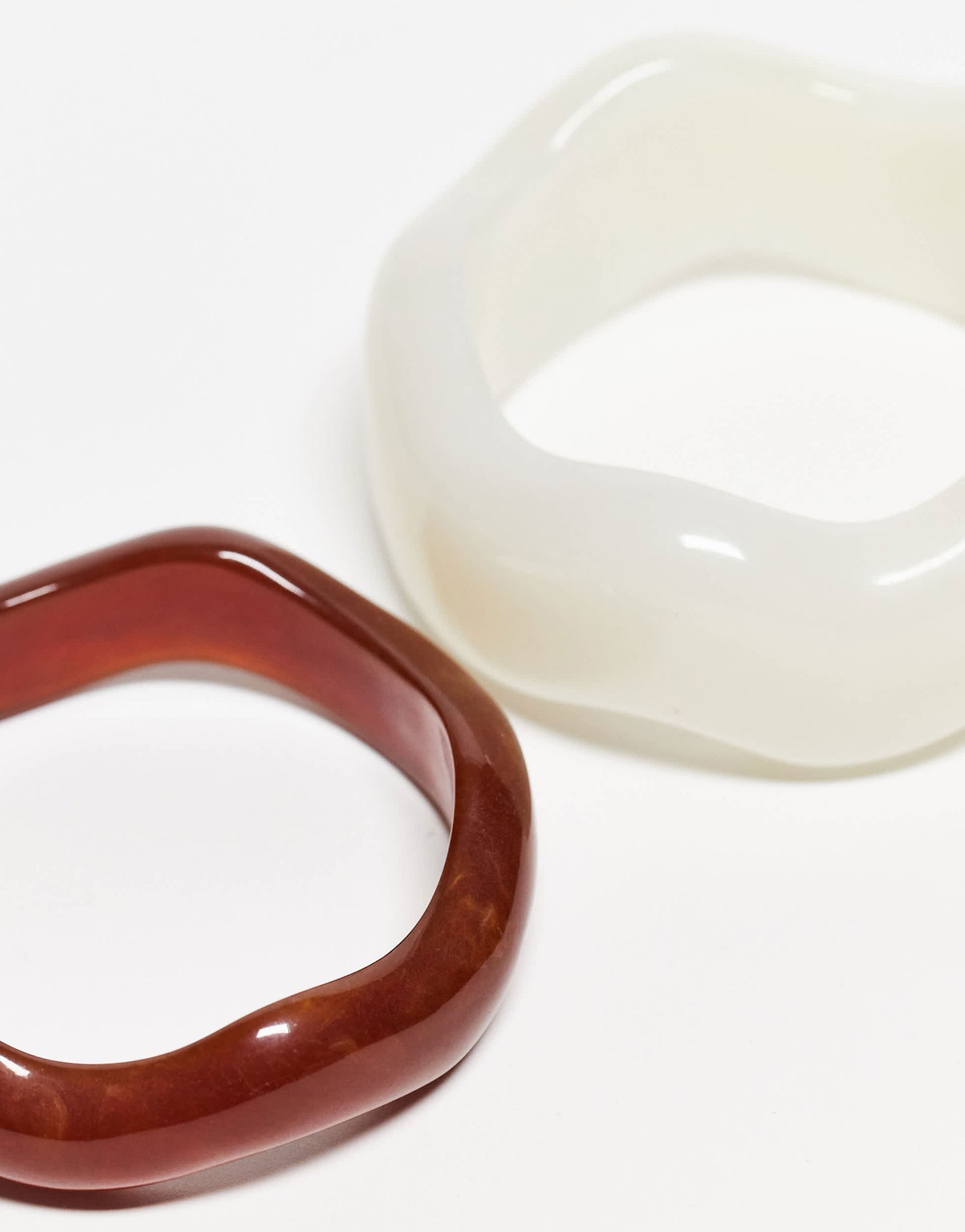 ASOS DESIGN pack of 2 resin bangles in wavy design