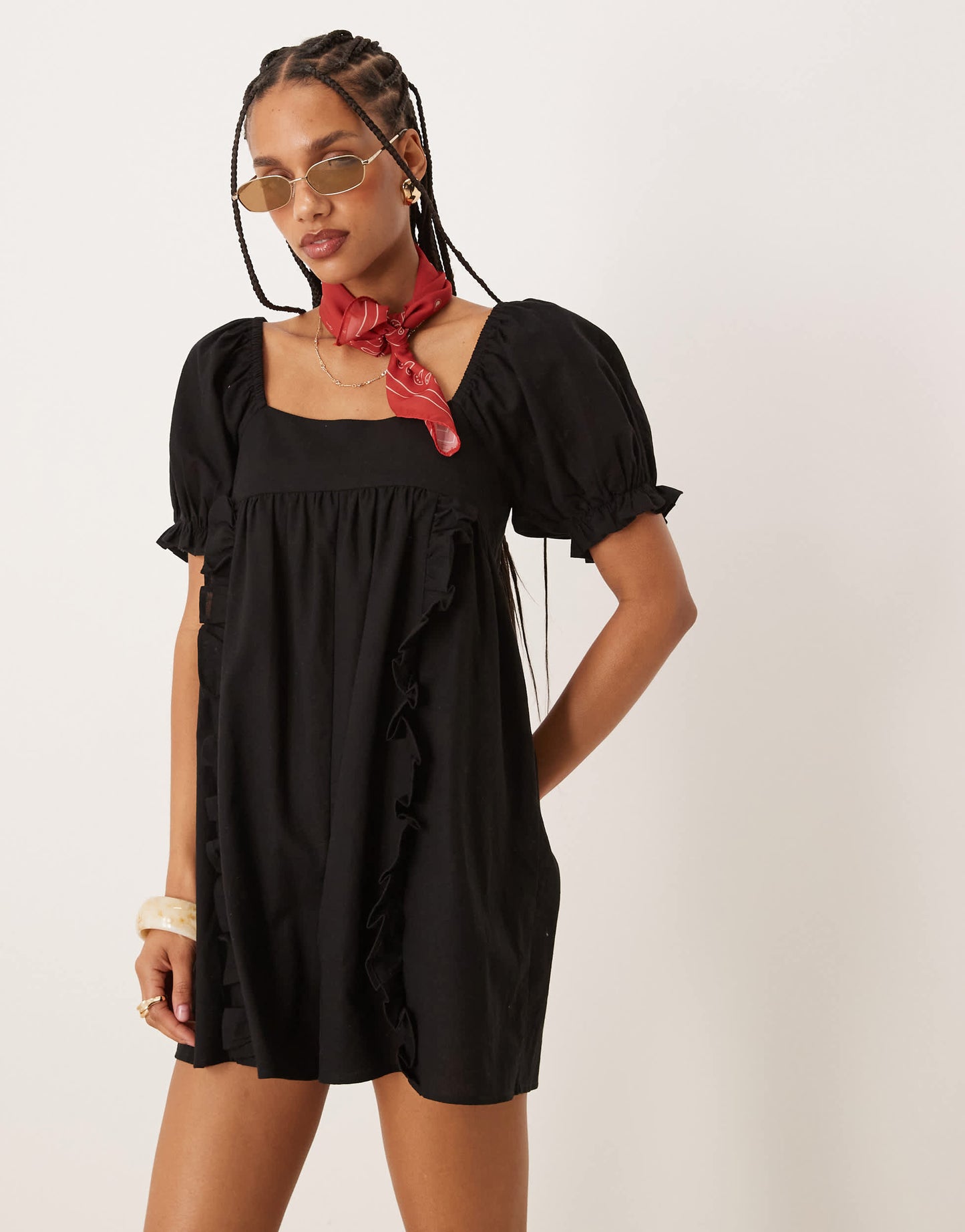 ASOS DESIGN linen babydoll puff sleeve playsuit with bow back detail in black