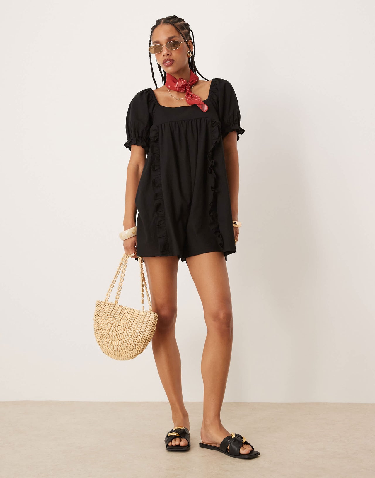 ASOS DESIGN linen babydoll puff sleeve playsuit with bow back detail in black