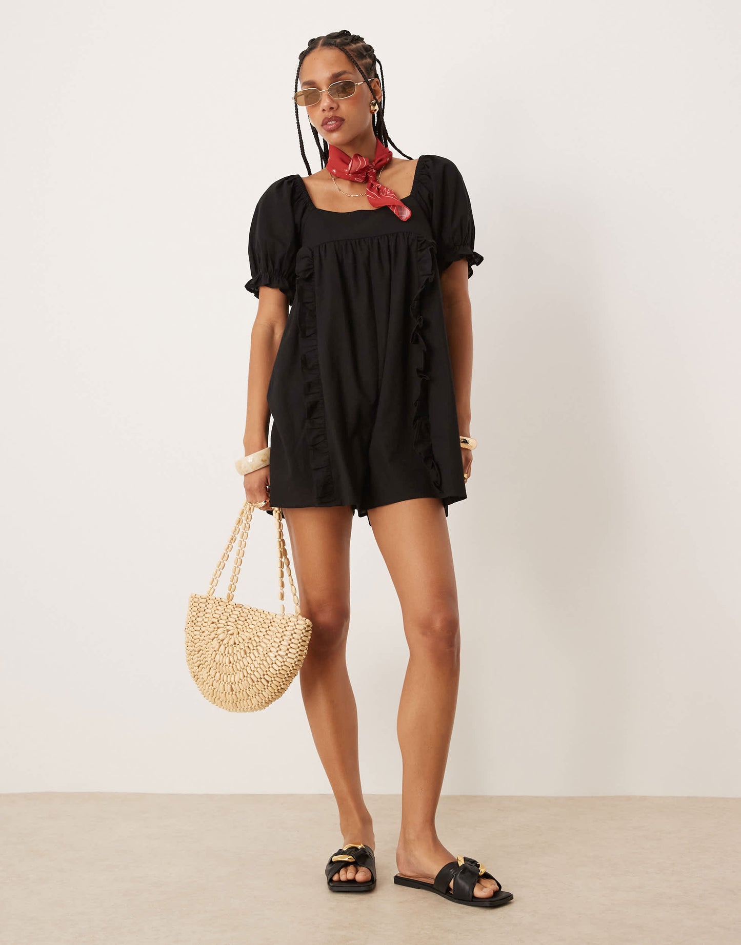 ASOS DESIGN linen babydoll puff sleeve playsuit with bow back detail in black