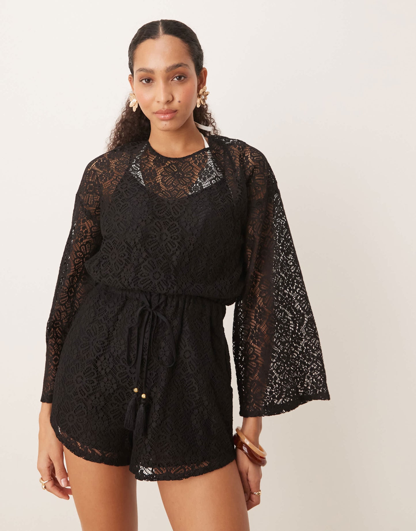ASOS DESIGN crochet long sleeve mini playsuit with drawstring in black